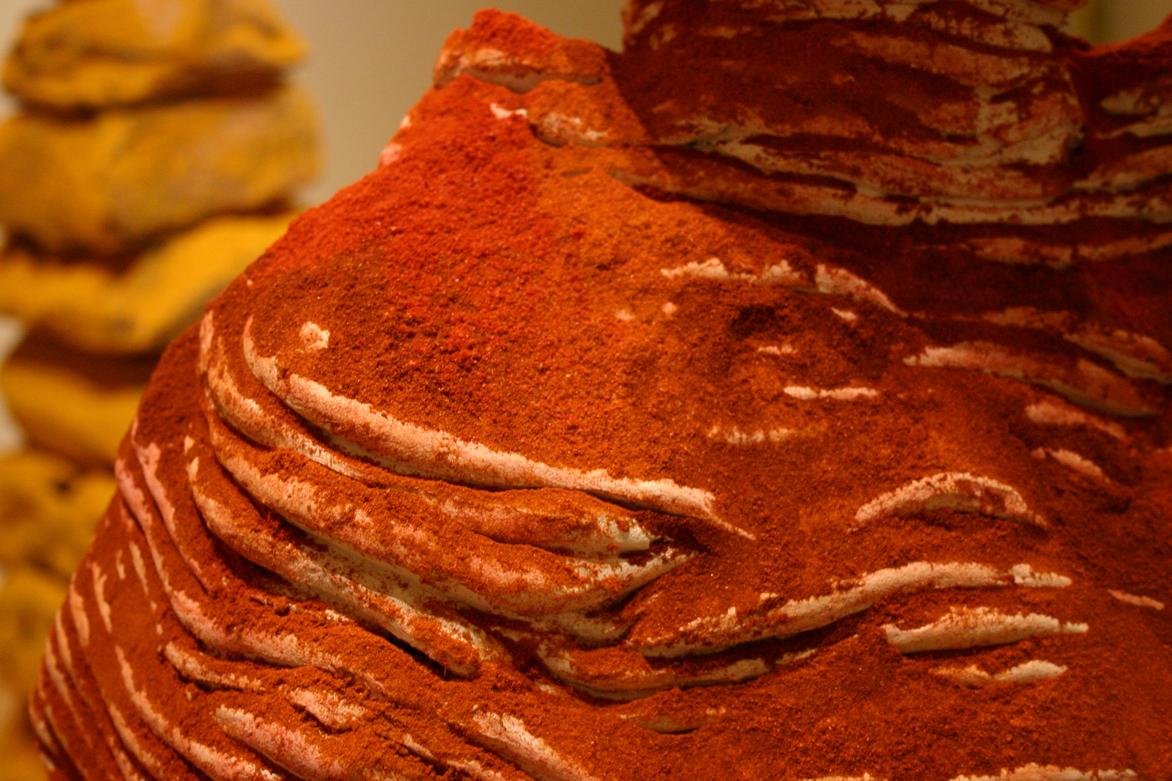 Detail of the red spice on the ceramic sculpture
