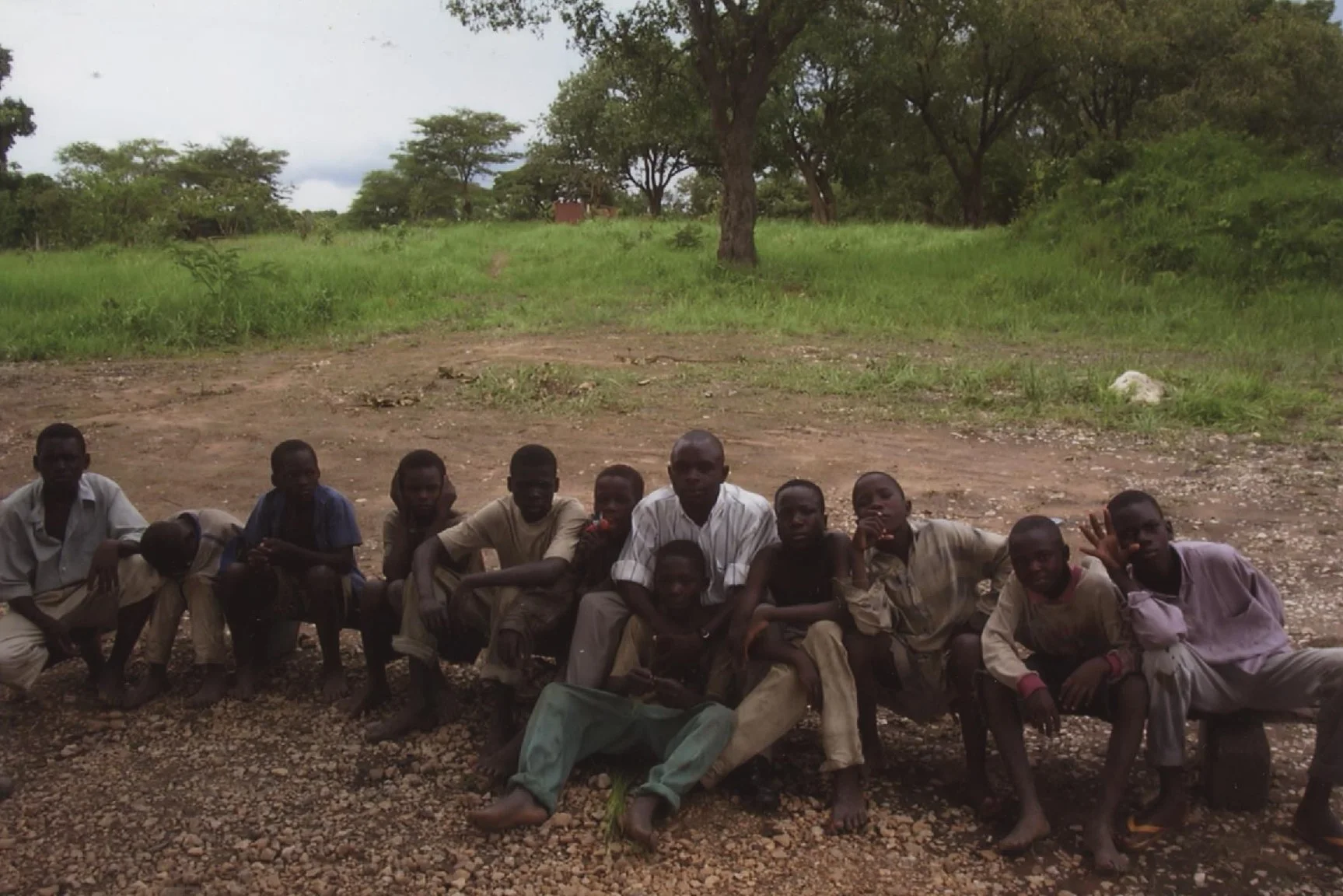 February 2002 Mulenga and a number of street children from Lusaka, Zambia pose for a photo. Mulenga ministered to this desperate and forgotten group of boys each week through the sharing of a meal and a bible study.