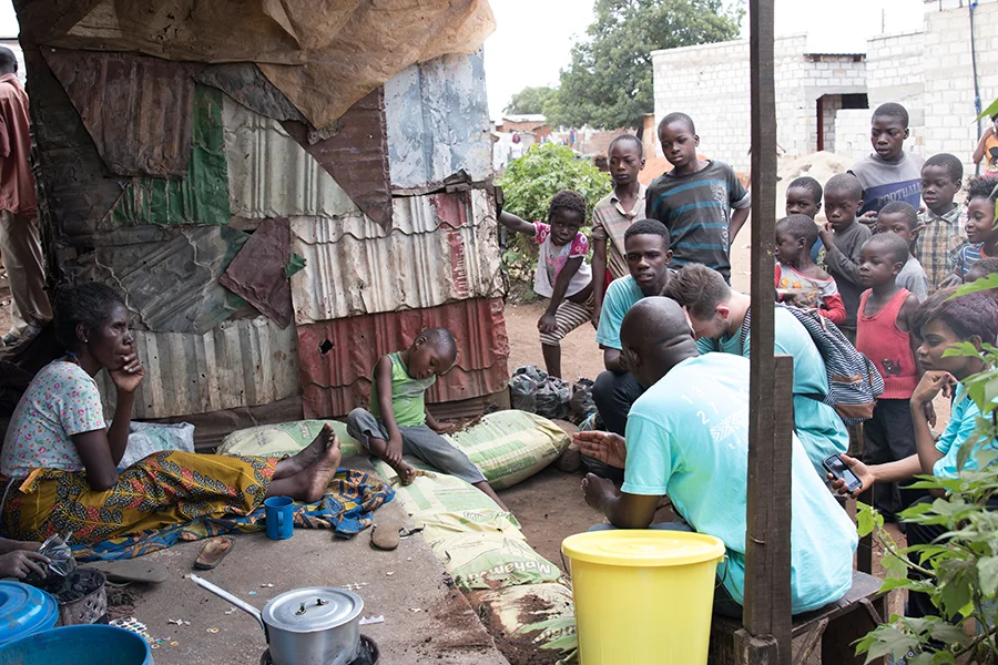 Giving out Cholera Prevention items to the poor in a slum. 