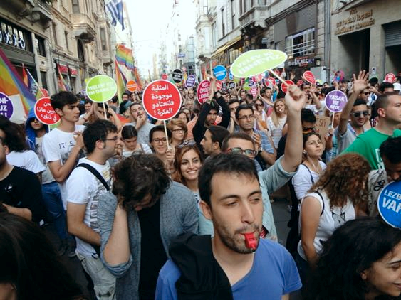 A sign in Arabic reads “Homosexuality is here, get used to it.” (Courtesy Adam Rasmi)