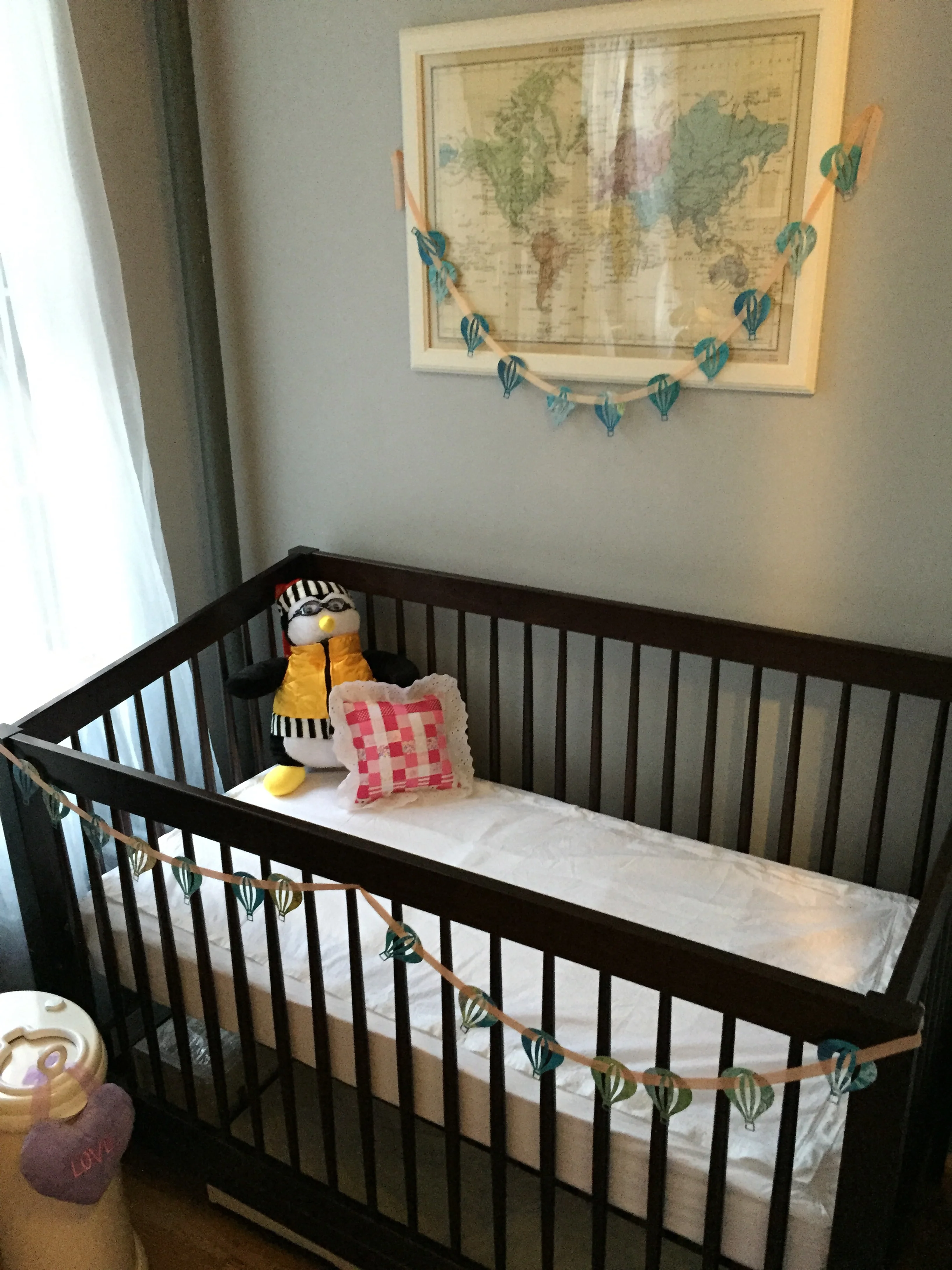 Lucie's crib is ready! (Yes, that's Hugsie, Joey's bedtime penguin pal from Friends.)