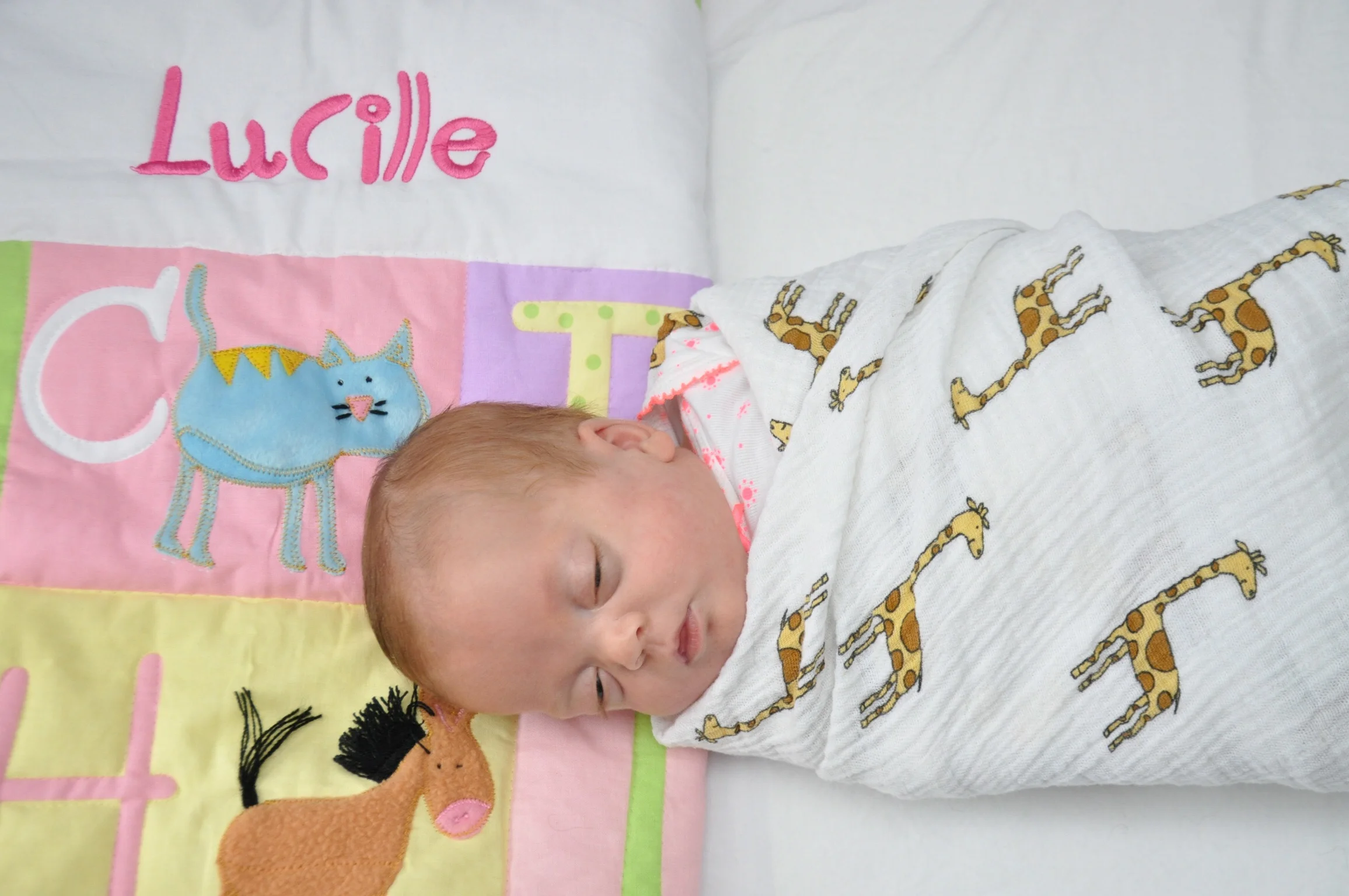 Lucille loving her crib