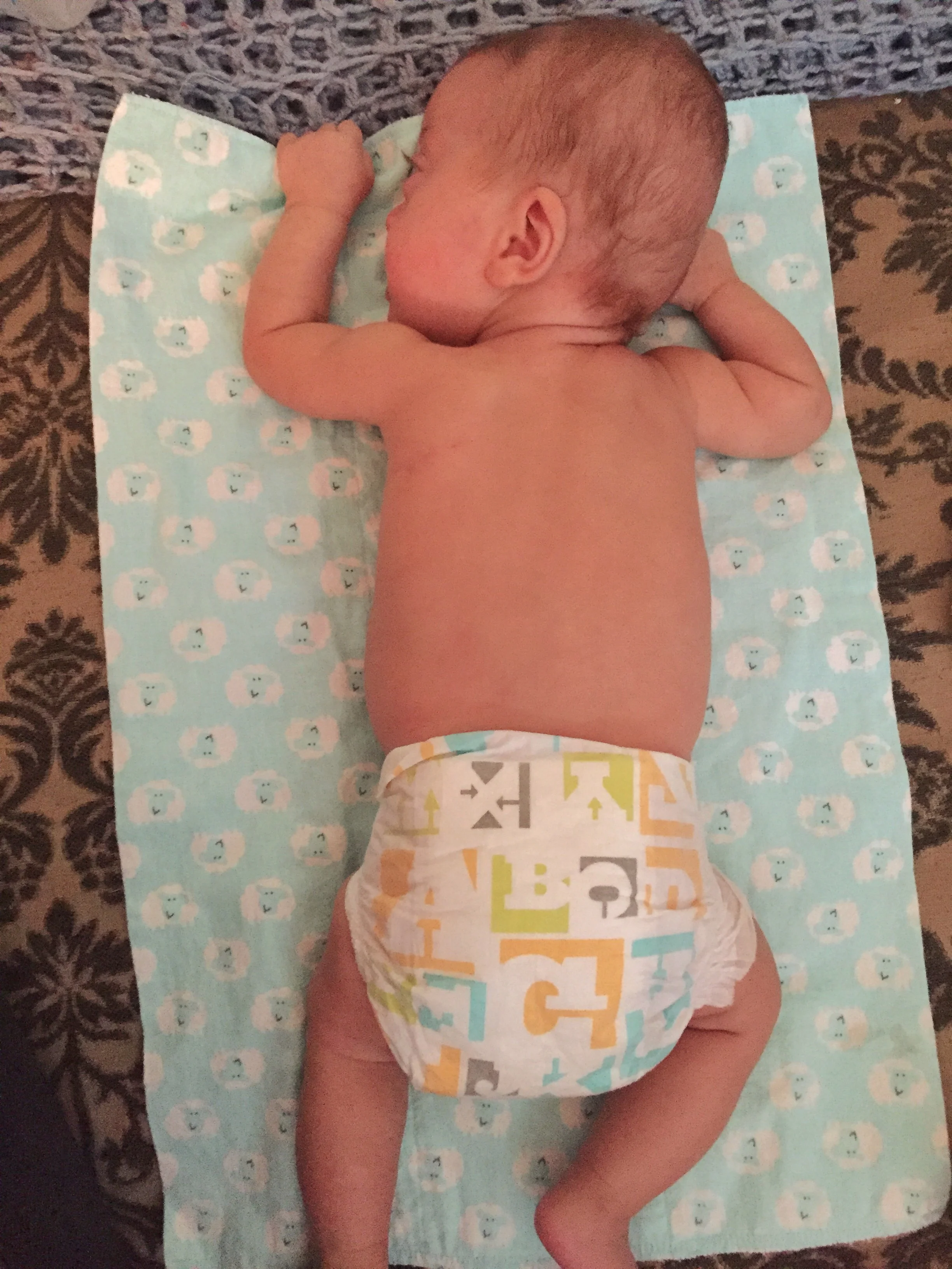 On her tummy, and then...