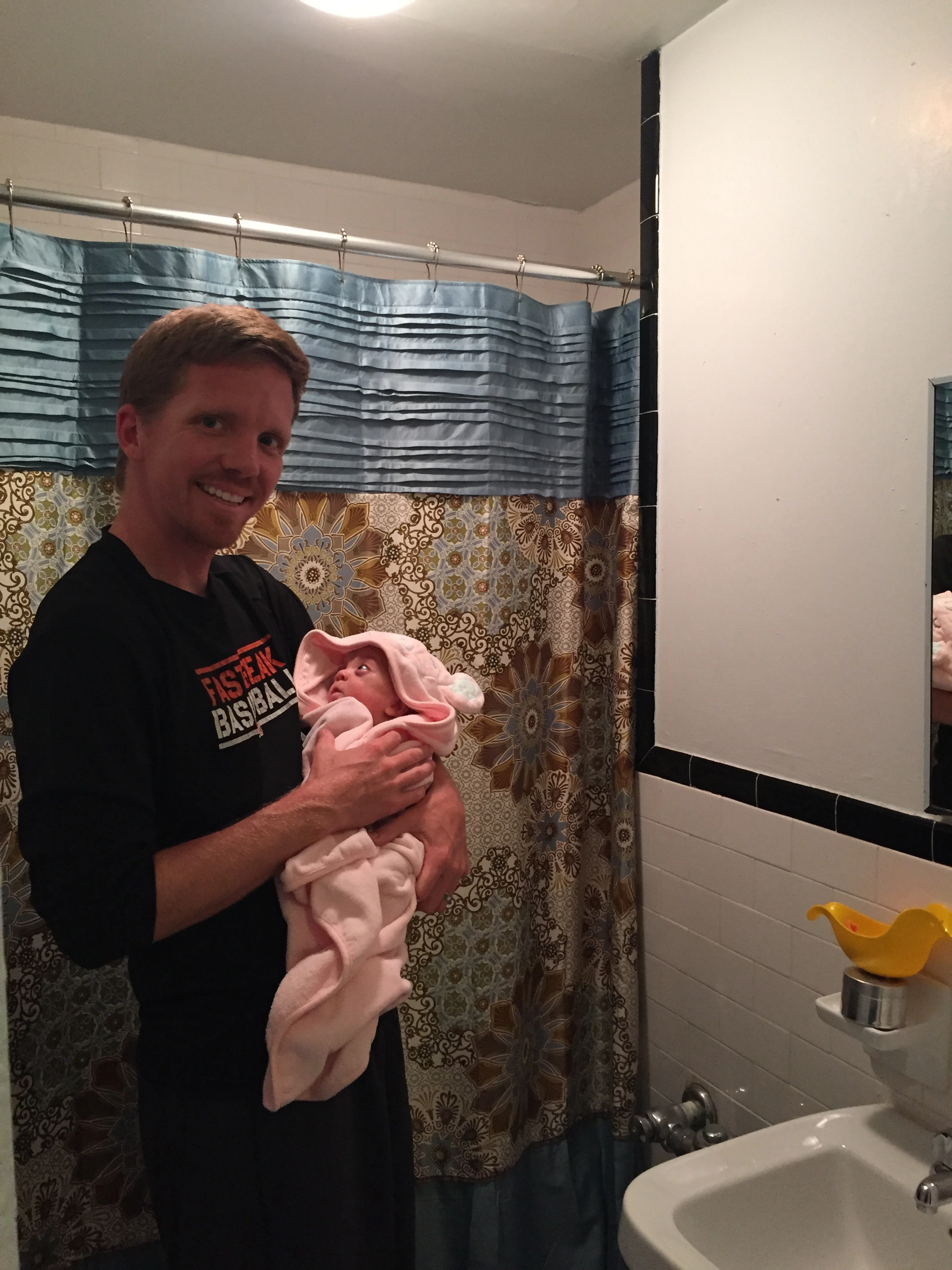 Bathtime fun! She's mesmerized by her Daddy!