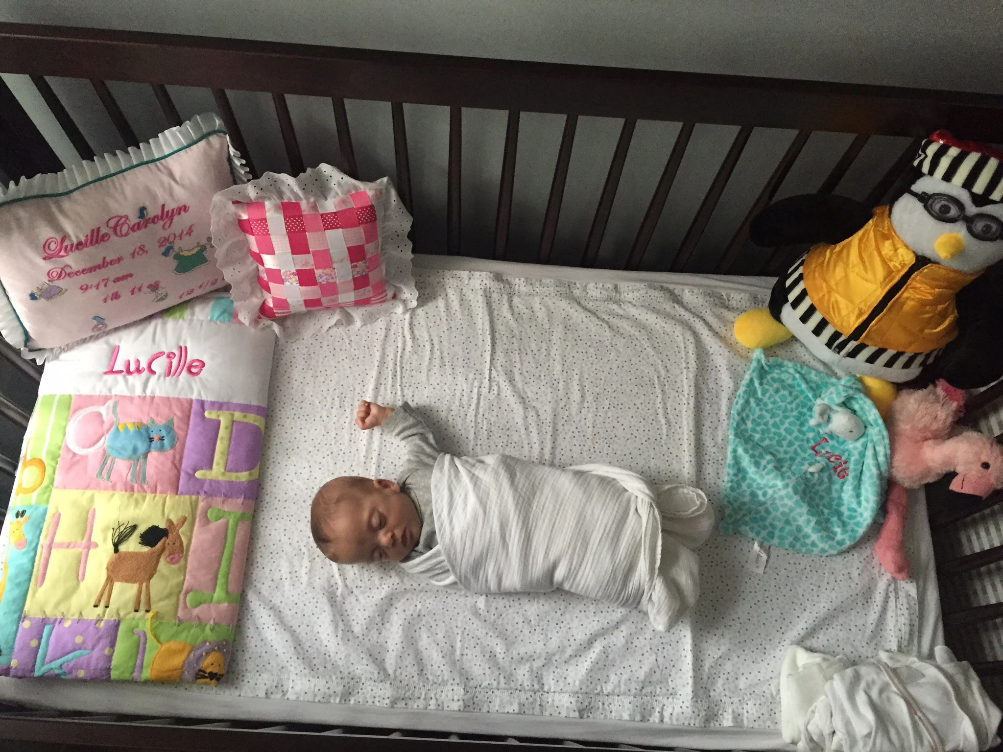She's been sleeping in her crib more and more, even though she still mostly sleeps in her rocker. When we swaddle her, we have to leave her left arm out or else she'll wake up within 10 minutes!