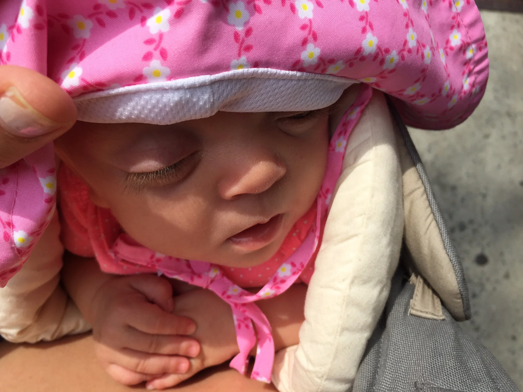 Asleep on the Ergo on a hot summer day in the city. Look at her precious hands. 