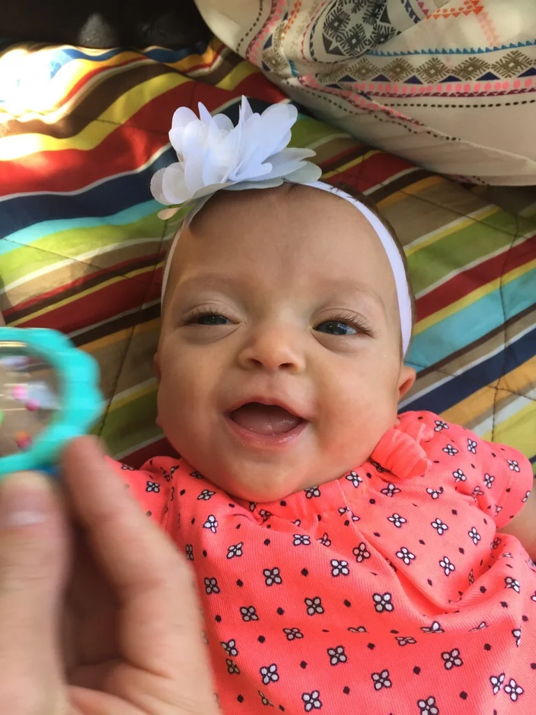 Loves to play with her rattle!