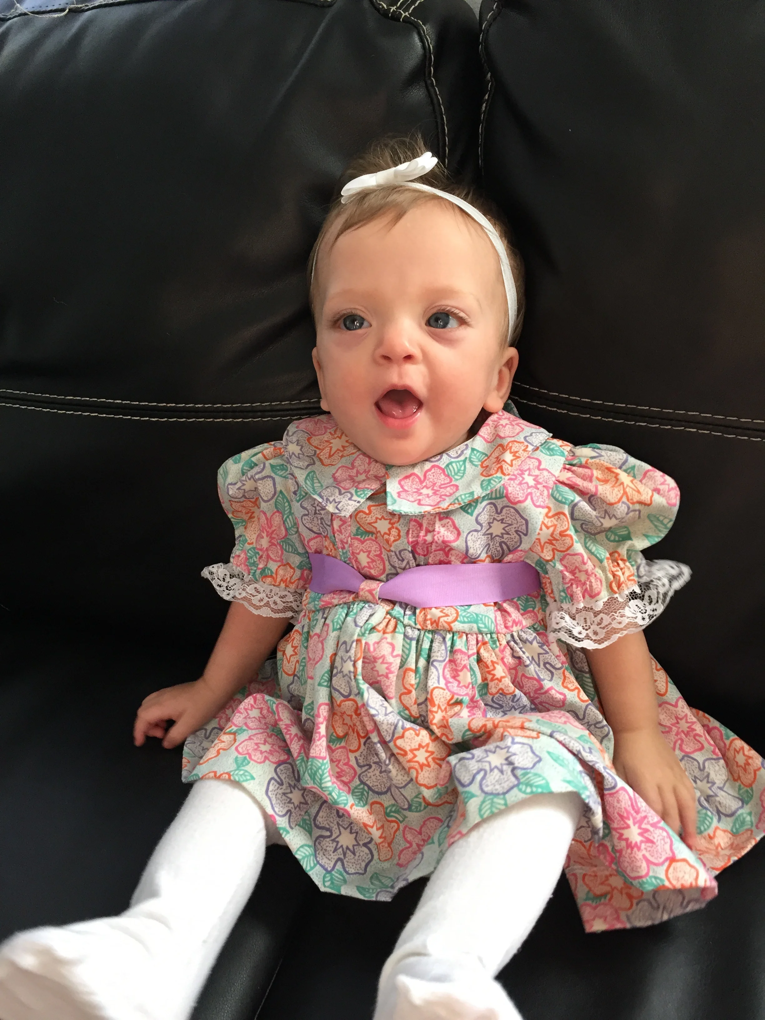 Lucie wearing a dress made from one of my favorite outfits as a child. My mom secretly saved it and had a friend make this for Lucie.