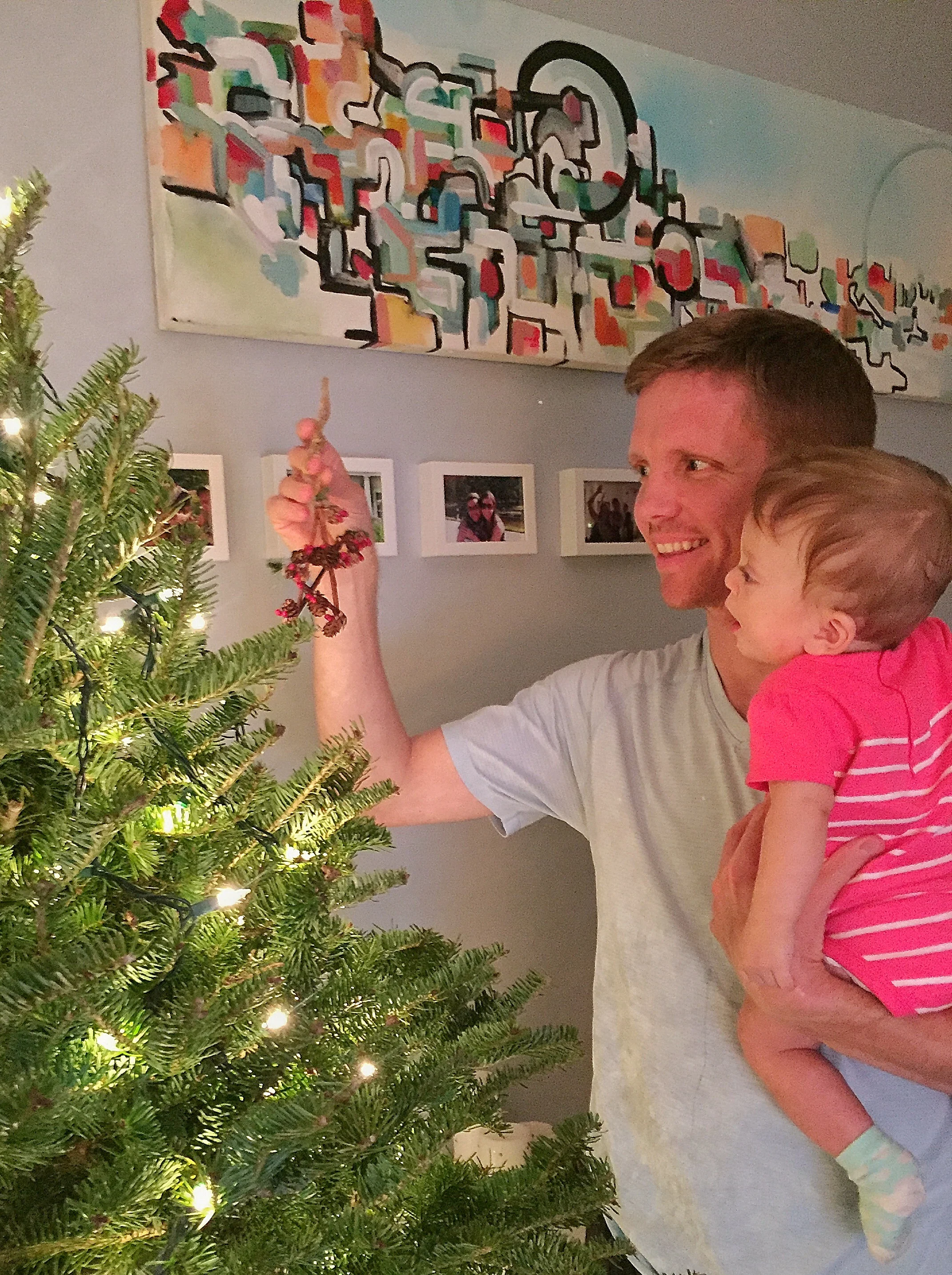 Helping Papa decorate, she had so much fun, as you can tell. 
