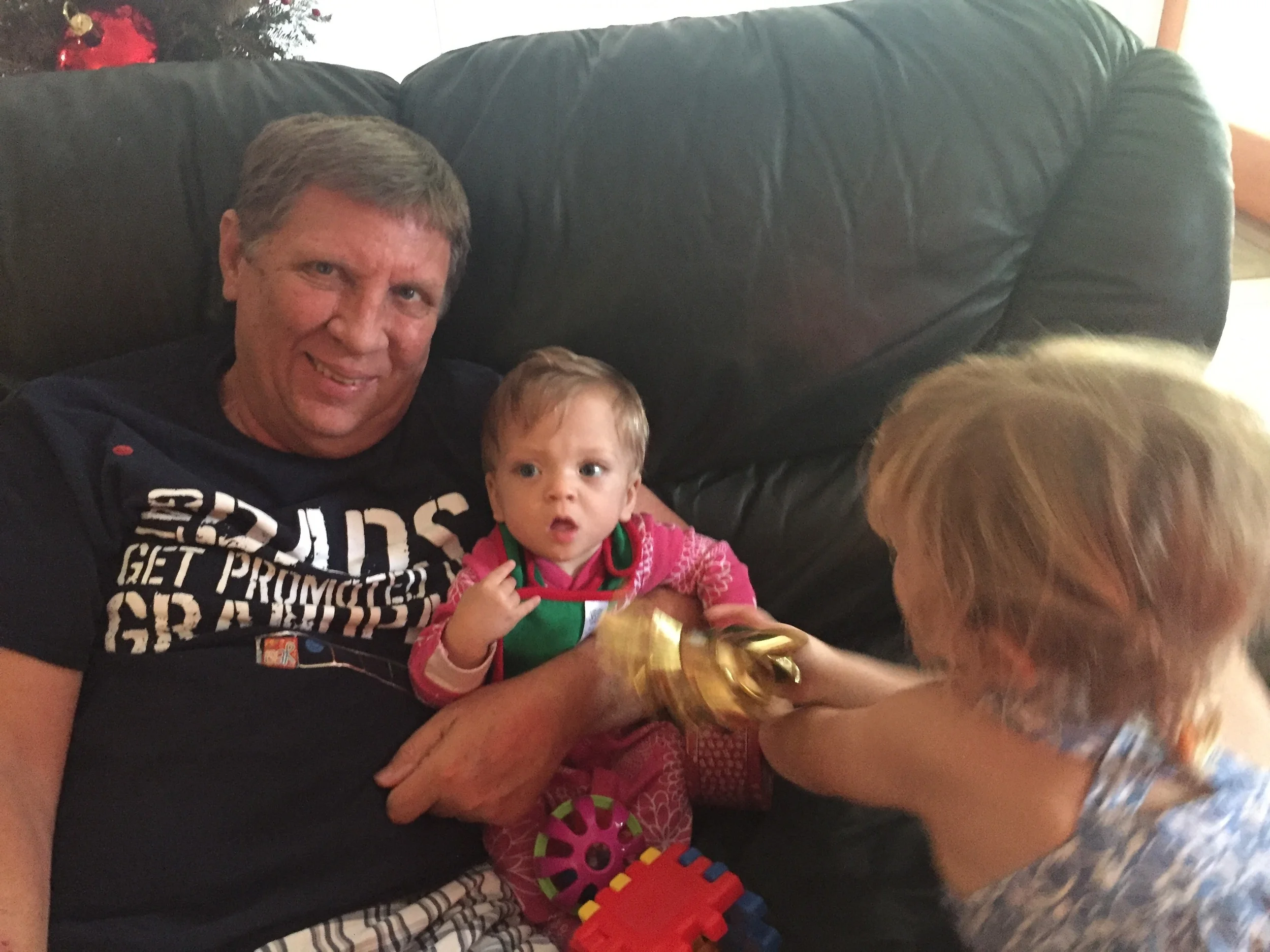 Abbo with his two granddaughters