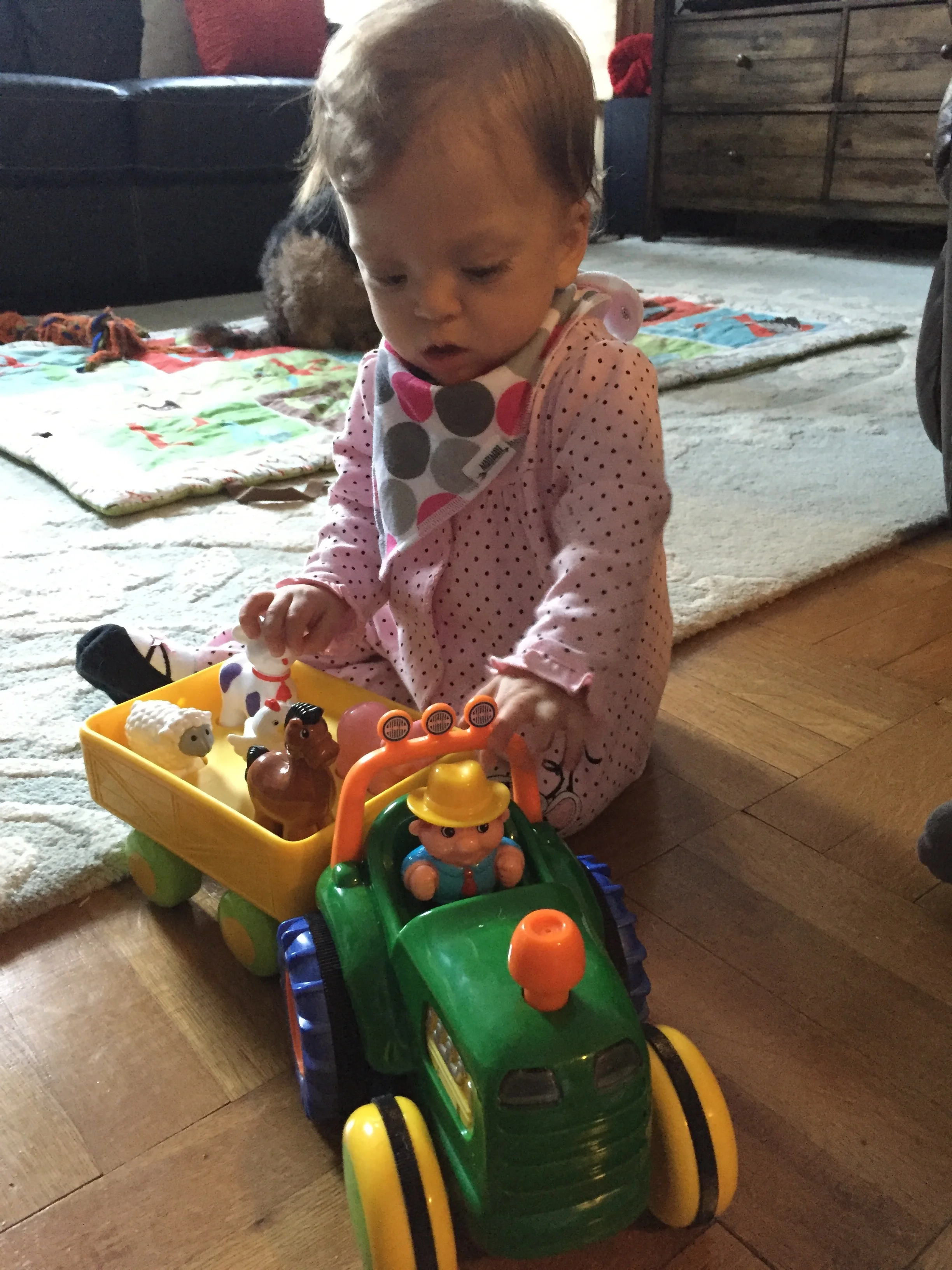 Loves her new tractor toy from her God Nurse. It's LOUD... thanks Jess!