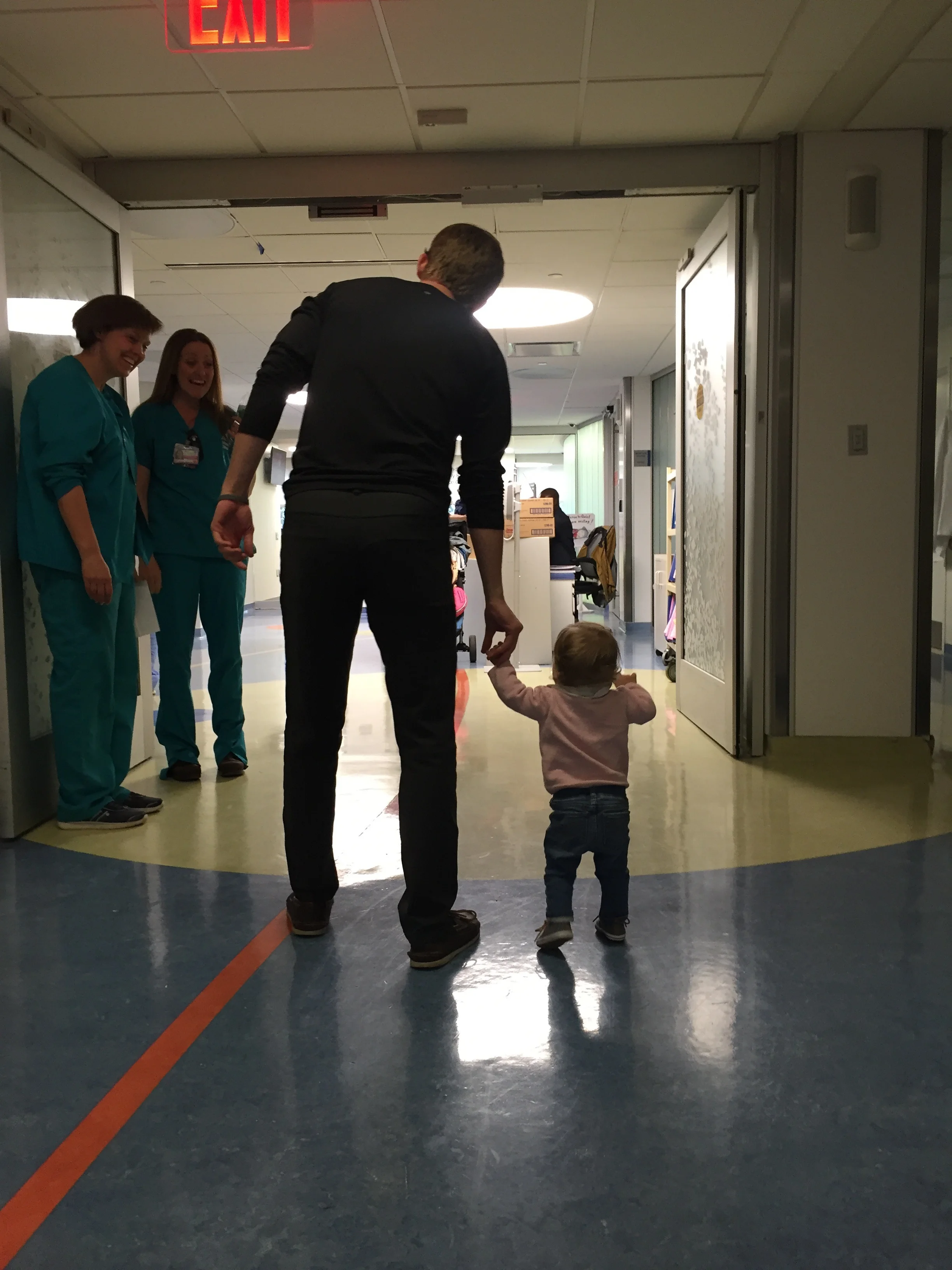 Last time we were here, we carried her out in her car seat. One year later, she's walking out :).
