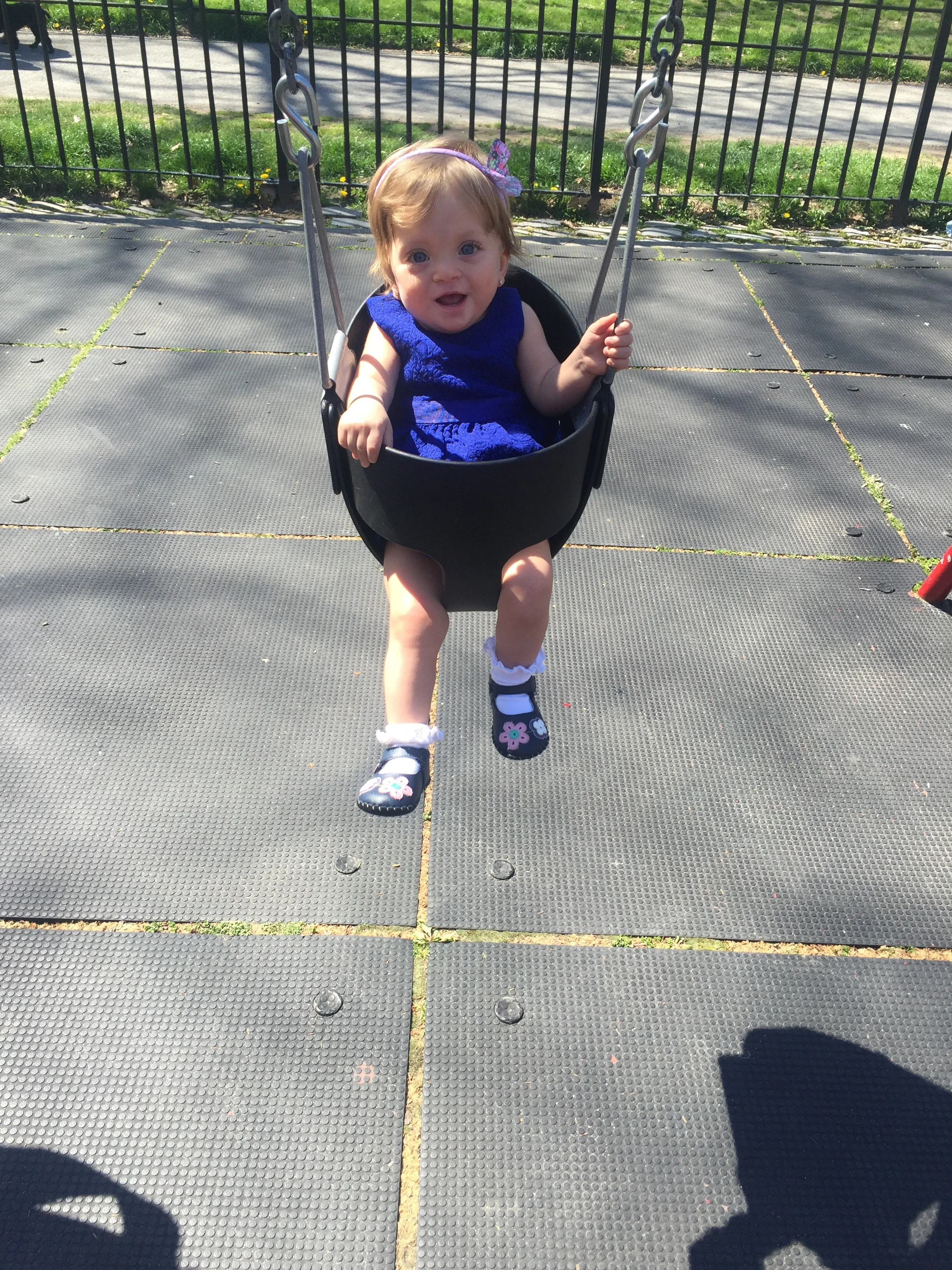 On the swings for the first time ever - at the playground at the 97th Street Entrance to Central Park