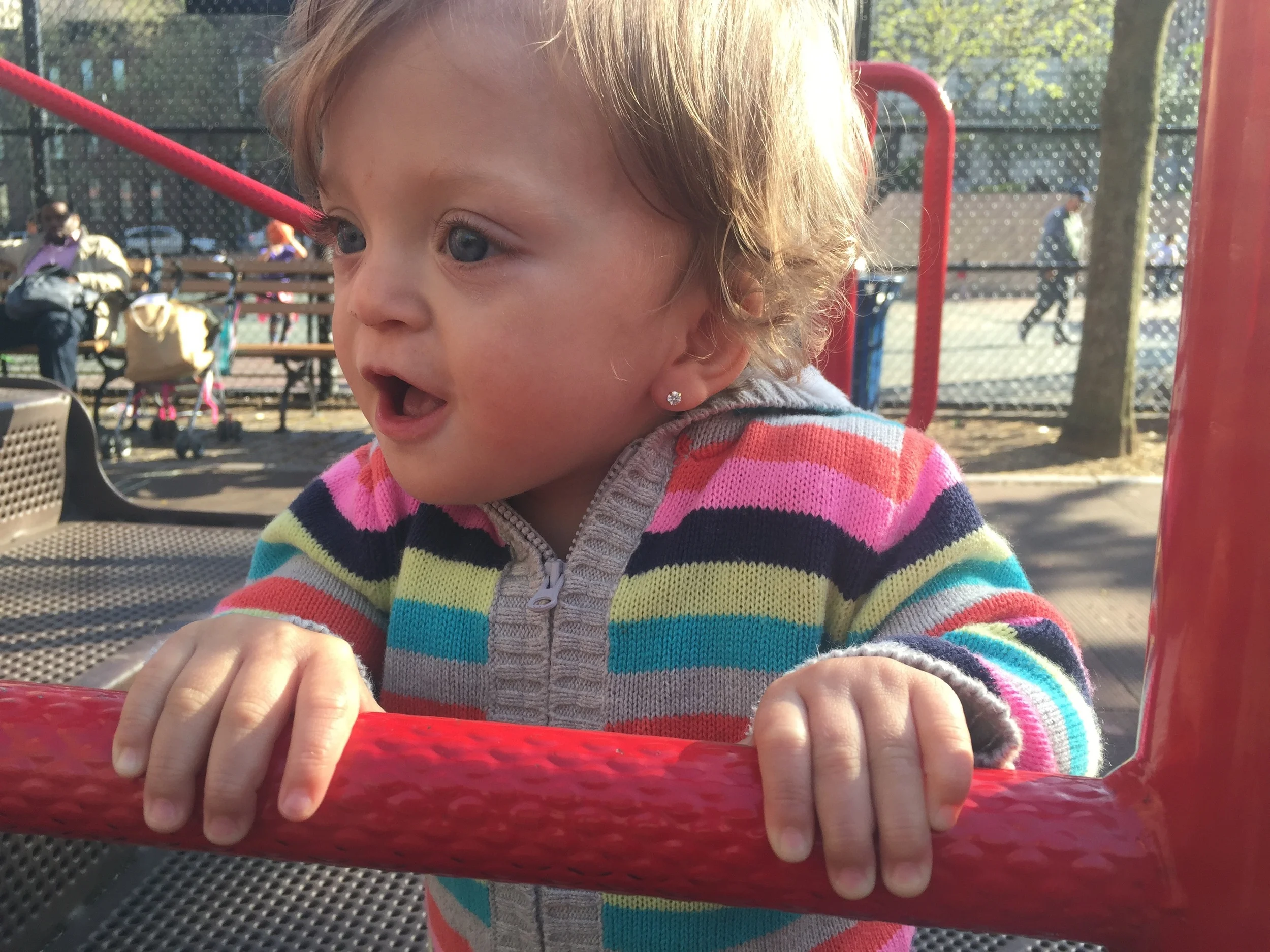 Watching the big kids run around and waiting for Mama to meet up after work.