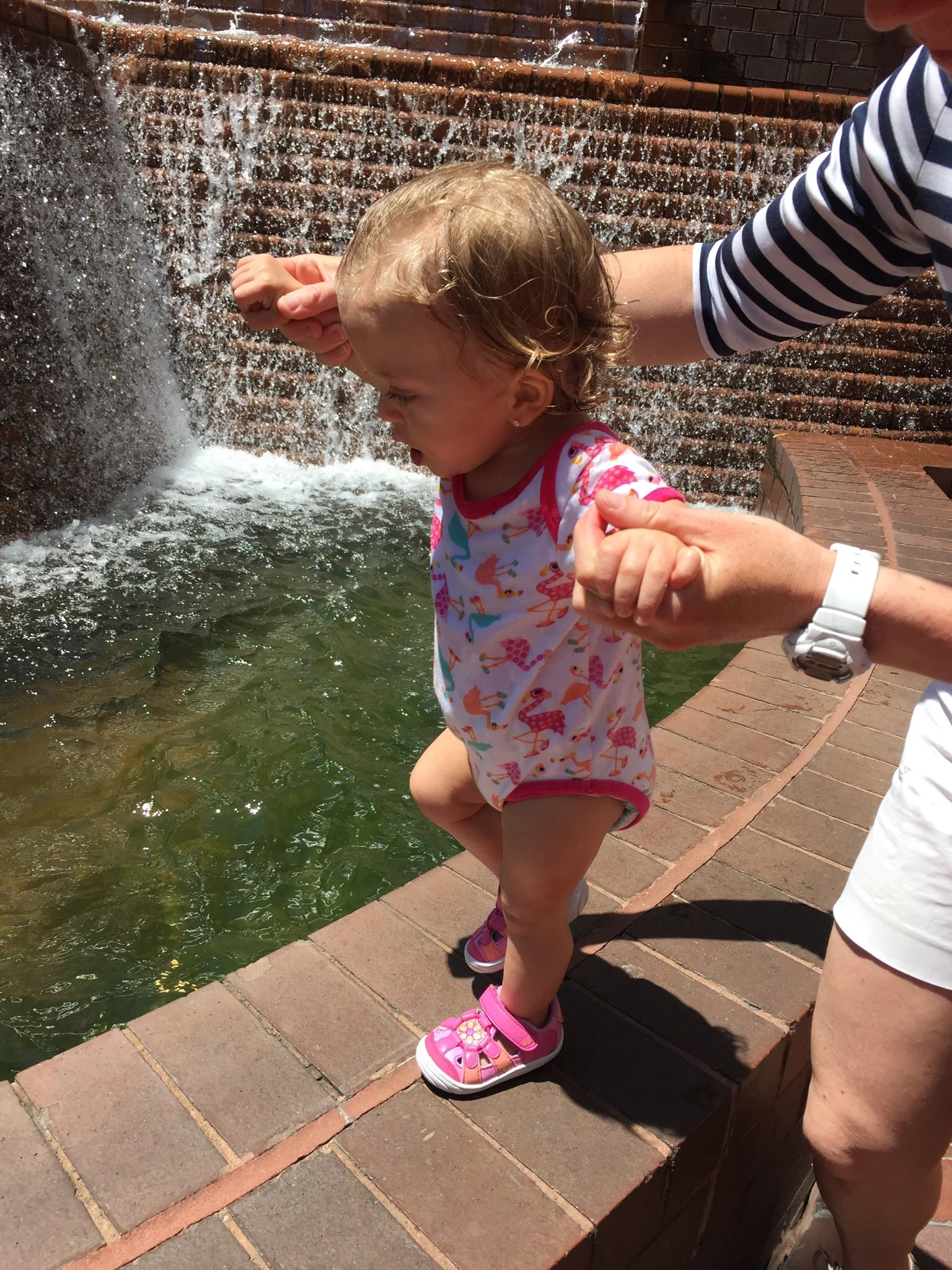 Walking along her favorite fountain.