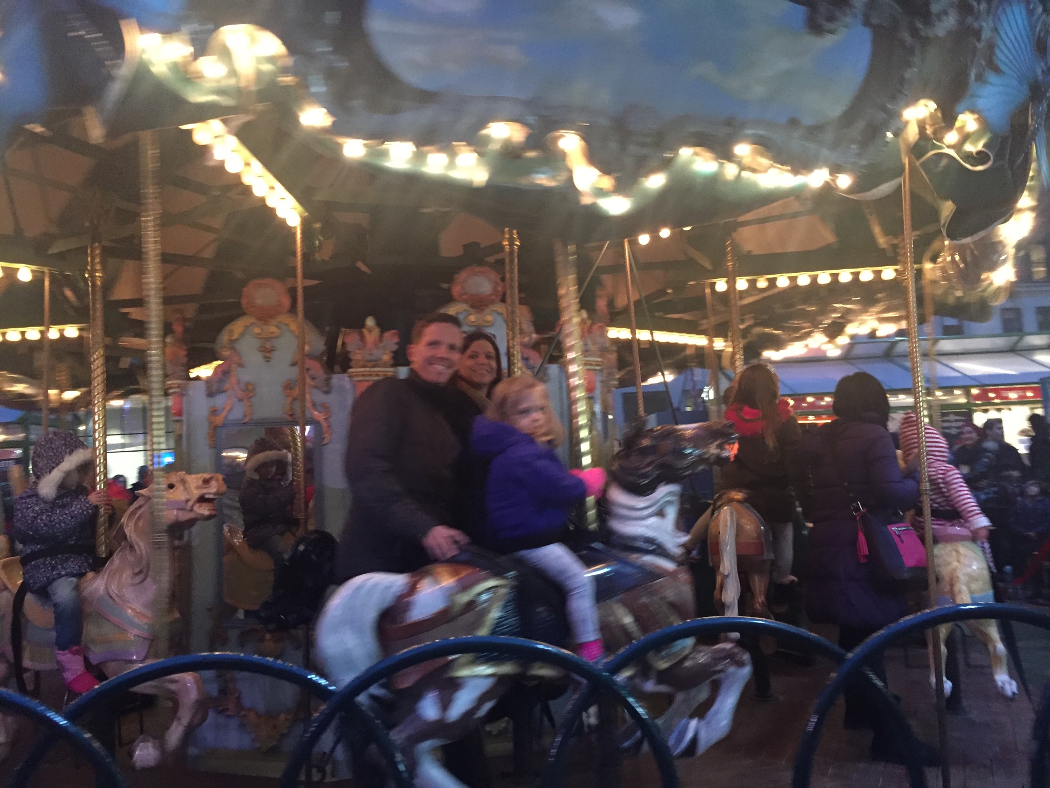  Abuela, Rob and Lucie on the carousel in Bryant Park. 