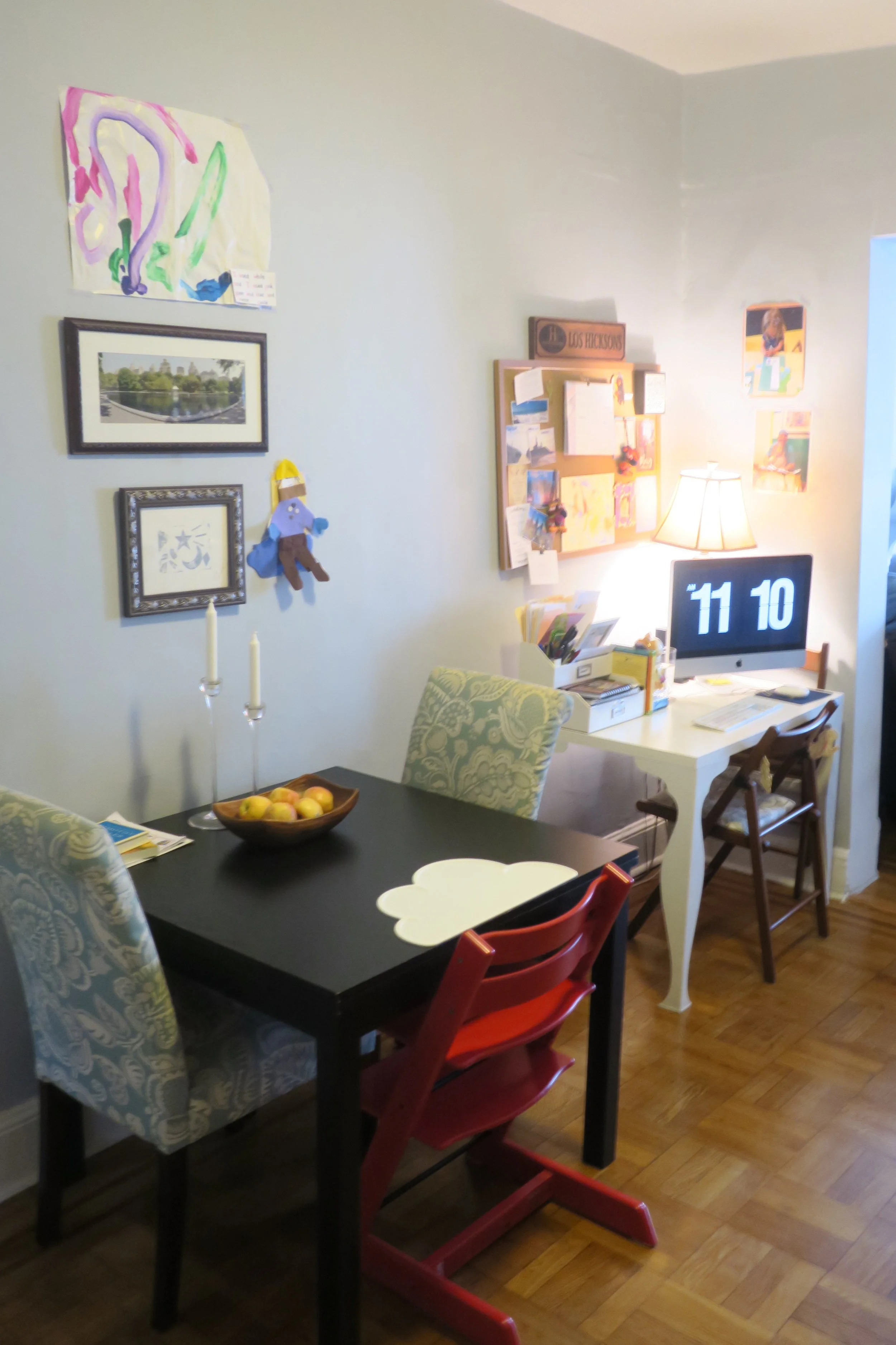  Across from her shelf/ play area is the dining room table and our desk space. 