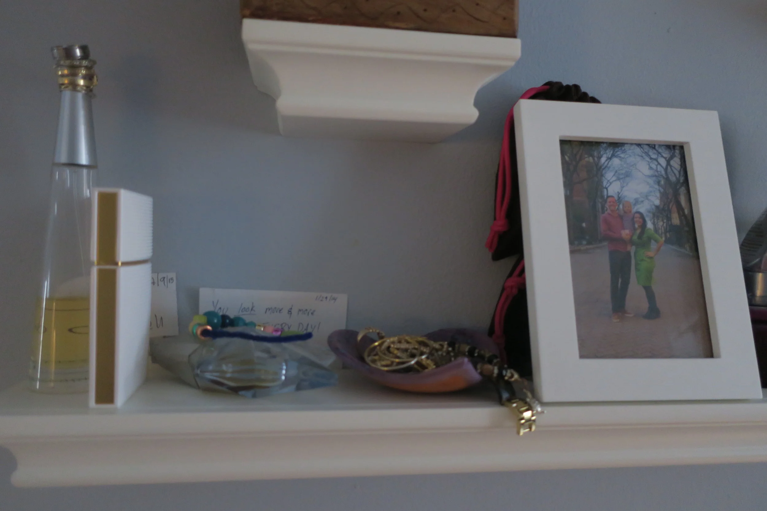  When we had Lucie we moved our dresser space to these shelves, so that we could turn the dresser top into a changing table area. 