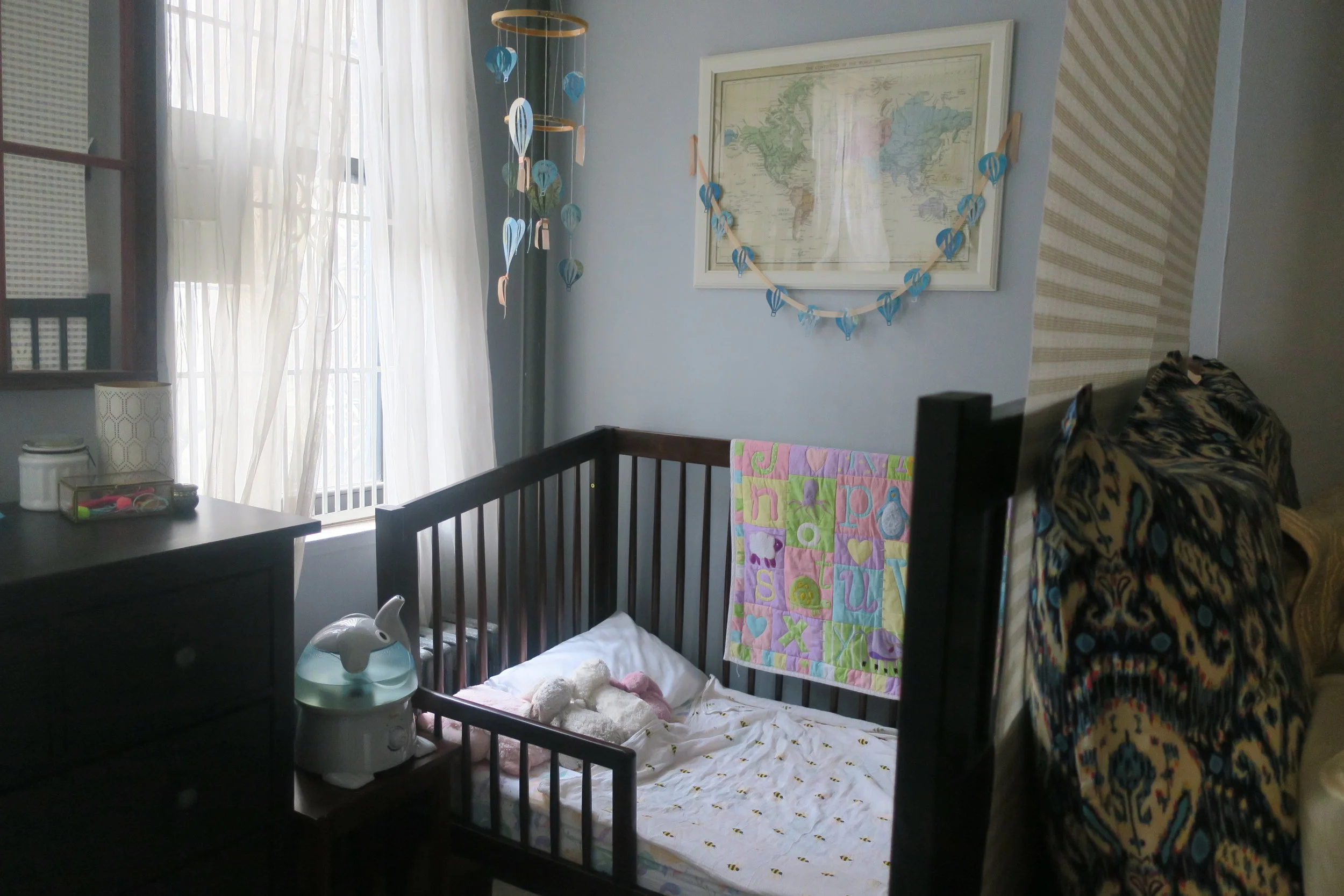  You can see how close Lucie's Nook is to our bed frame in this shot. The dividers hanging from the ceiling really help to separate the space for us though. 