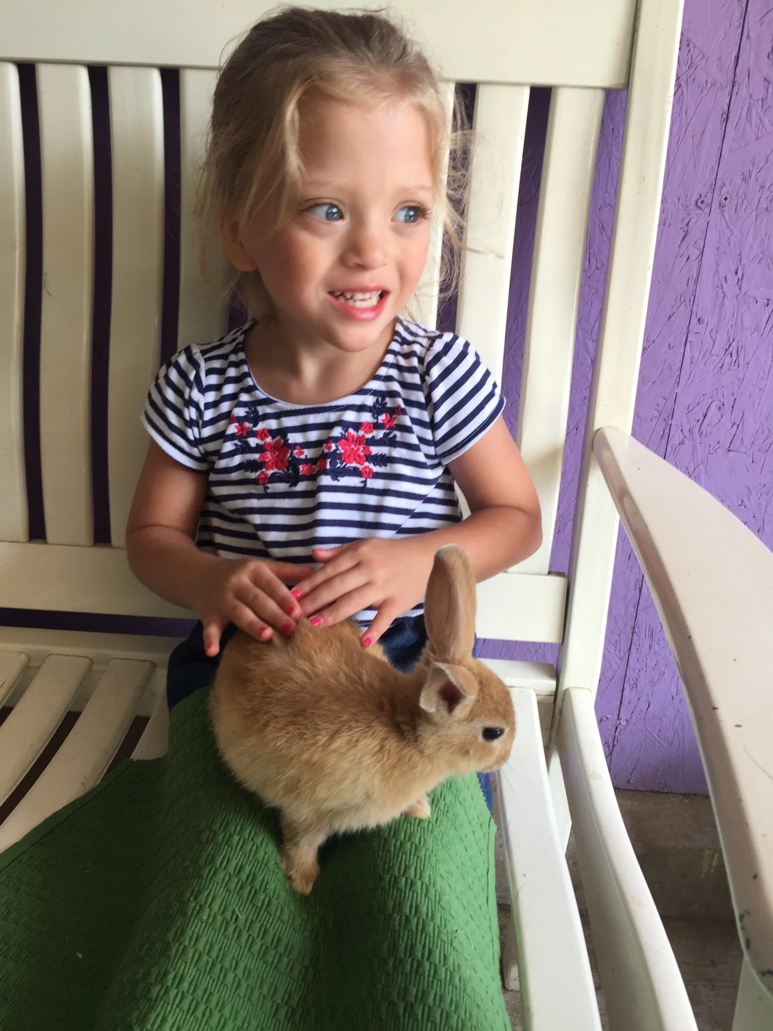 Lucie loooooved getting to hold the baby bunny.