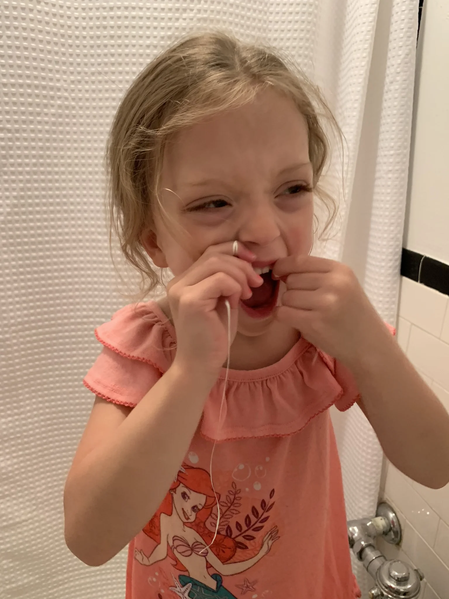 Flossing… another one of her favorite things. “The Dentist told me to floss every day!”