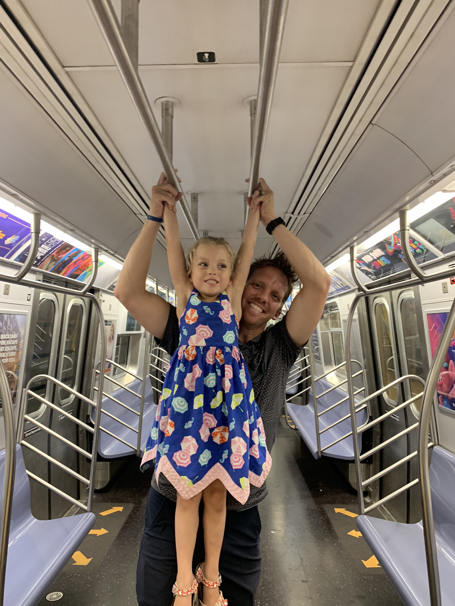 Monkeying around in a subway car all to ourselves. Whenever we take the train and have the stroller with us, we take the elevator from the street to the first level, and then take another elevator down to the platform once we’ve gone through the turnstiles. Any time it’s just us in the elevator we have a dance party. As the elevator doors close, when she can tell nobody else will be joining us, Lucie hypes us up be going “Aaaaaaaaaaaa…” followed by a chorus of, “Dance Party! Dance Party!” Sometimes we get to have a Dance Party in both elevators on the way down, and then on both elevators when we are getting out. FOUR DANCE PARTIES!
