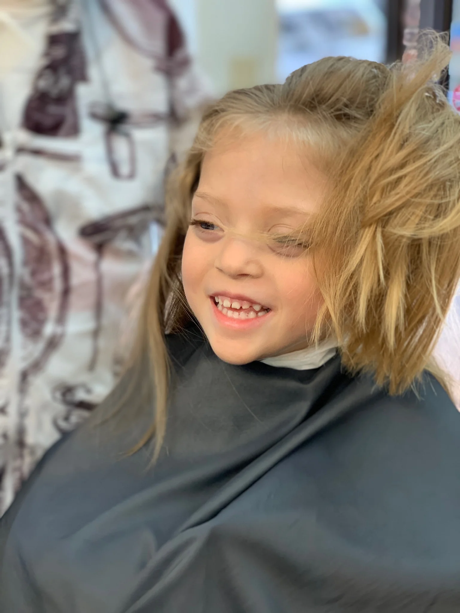 Getting her haircut by daddy’s barber around the corner is one of her favorite things.