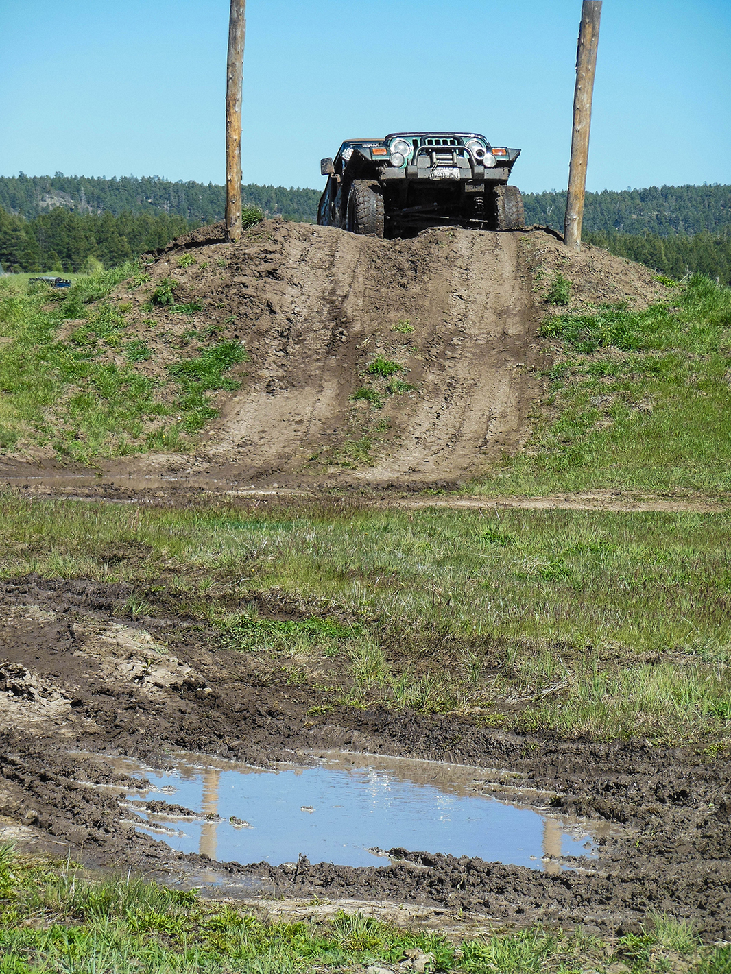 With all the rough weather the driver's course had been closed the entire expo. Late on day three after the expo was over Joni captured this Jeep braving the mud.