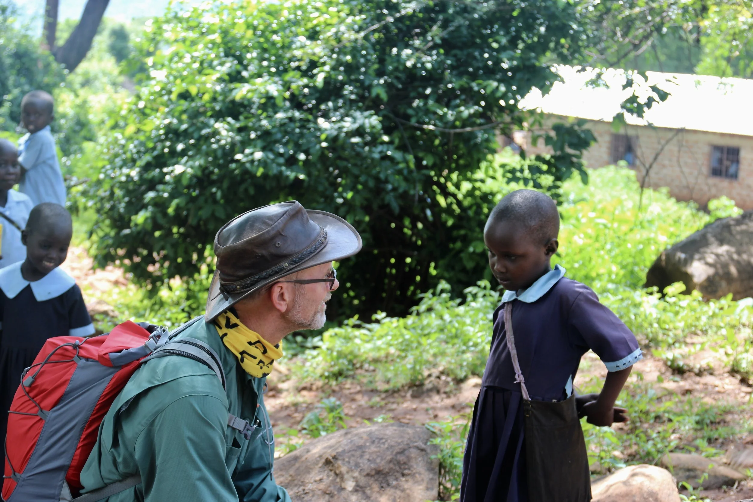 Eddy Ruble shares a moment with students of Sisit