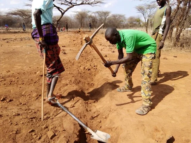 Over 100 community members turn out to dig the pipeline trench