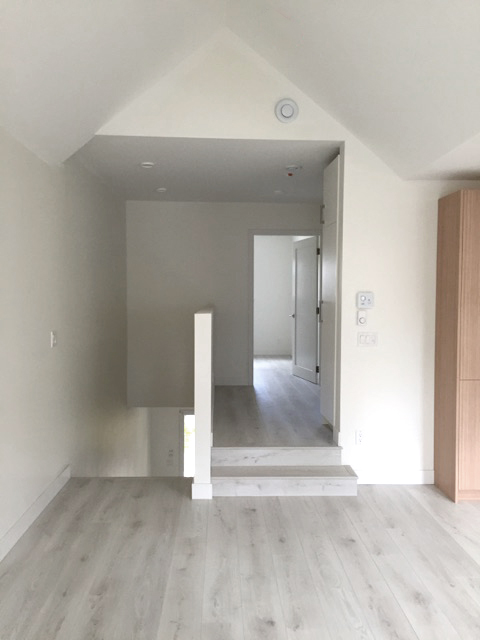 Dining + living looking towards bedrooms_upstairs.jpg