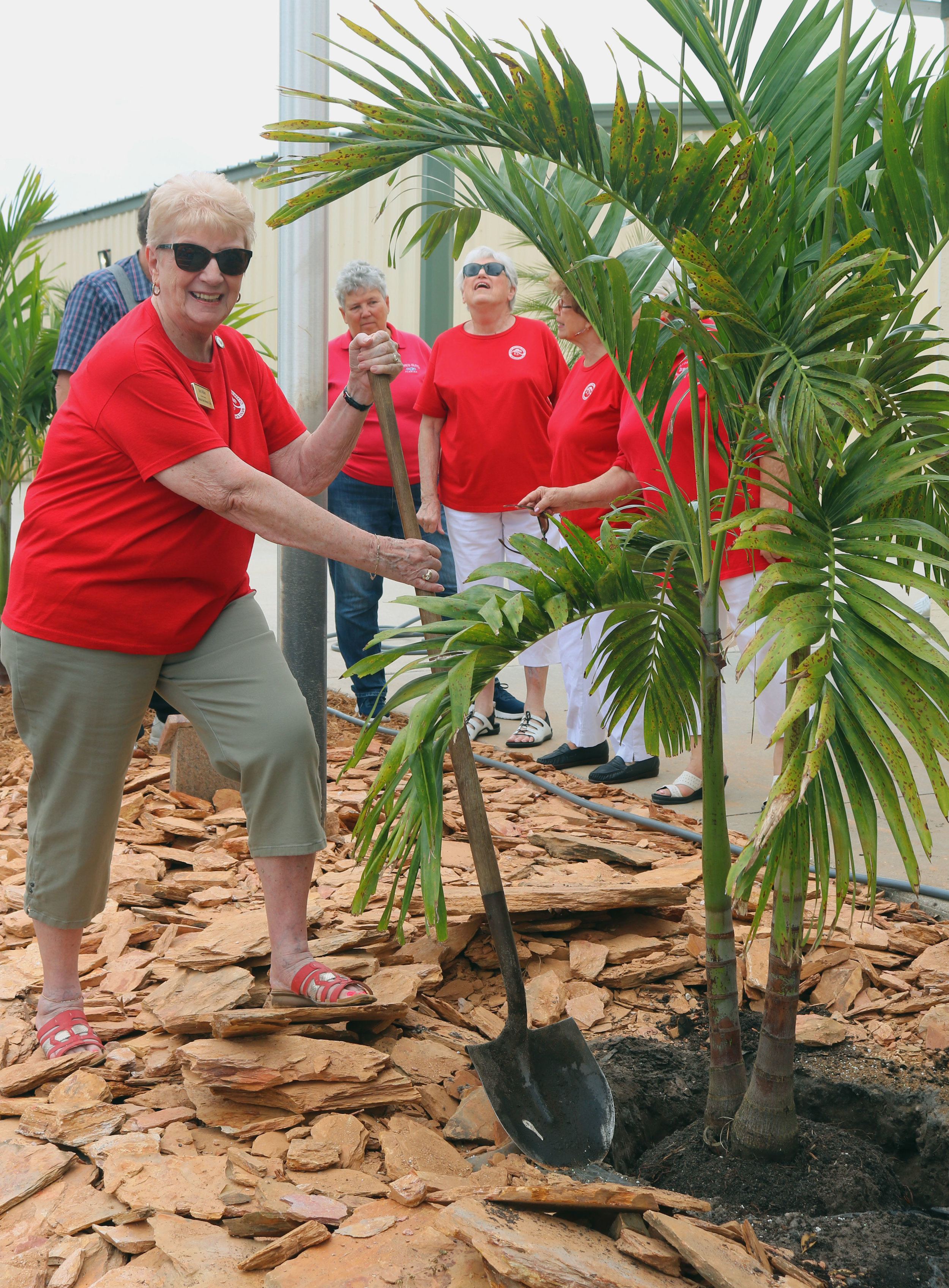 President Doris plants a tree.jpg