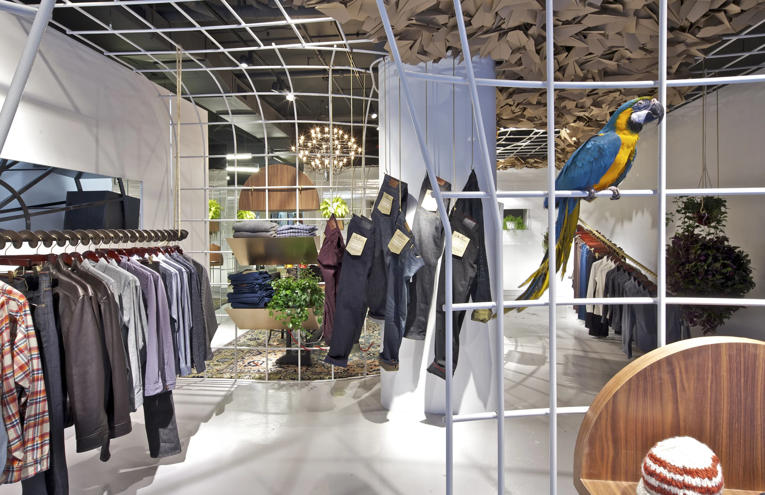 Raleigh Denim New York, NY Architect: OMA Patrick Hobgood, Project Architect Program: 1,000sf (100m2) retail space located in the Soho neighborhood of New York City. A flexible hanging system was used to create distinct spaces within the existing volume: changing/fitting rooms, parlour room, display area, window/entry, foyer space, and storage. Client: Raleigh Denim Workshop