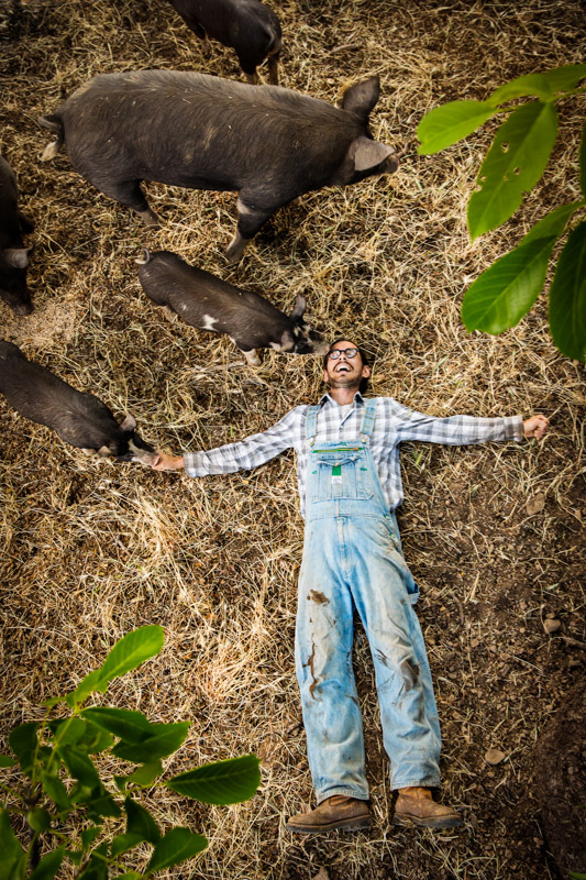 Jake Francis and his pigs. Photo courtesy of Brian Hodges