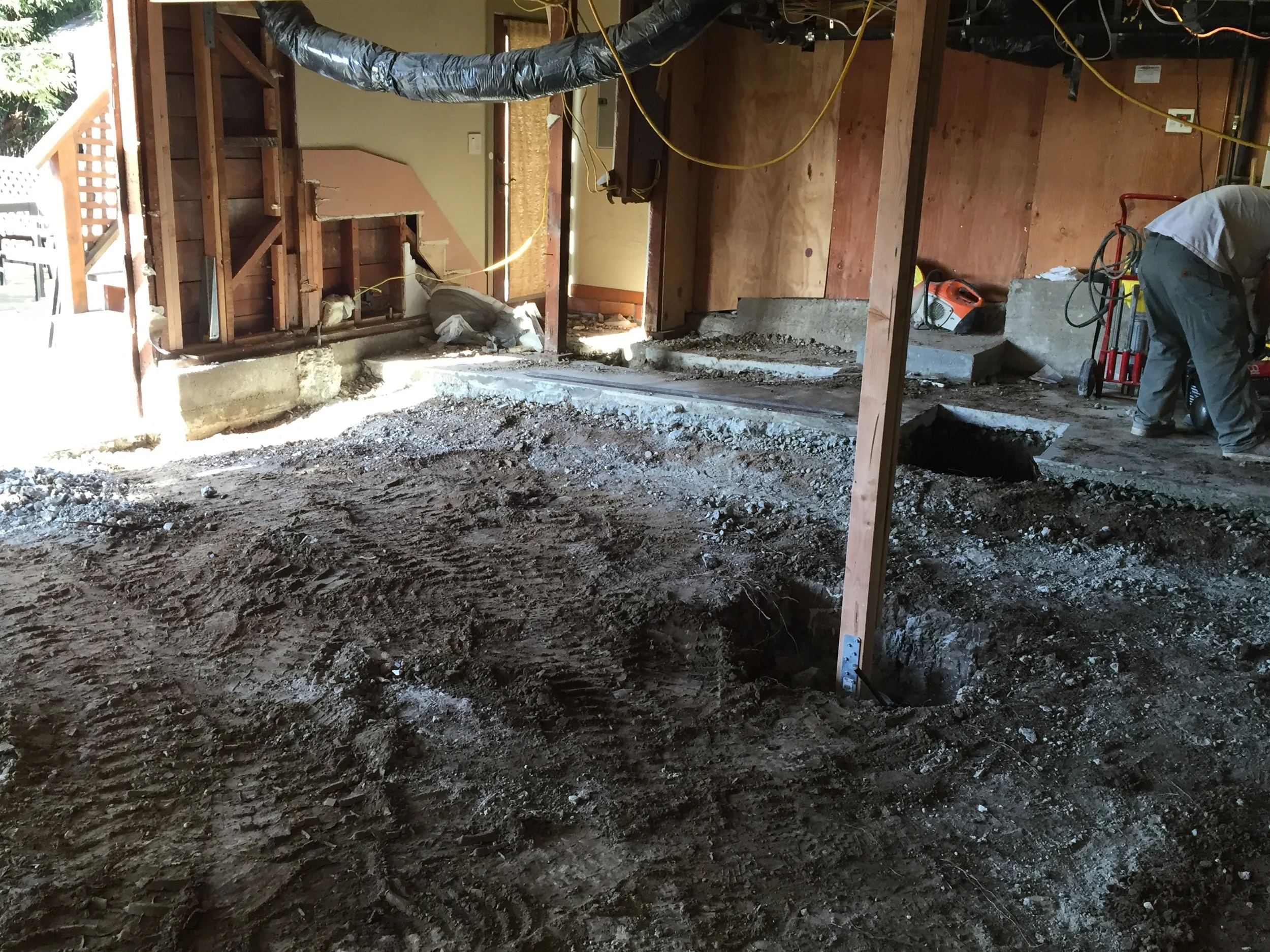 (Fast Forward 3 hours) garage slab and foundation are gone. Ready to remove dirt. 