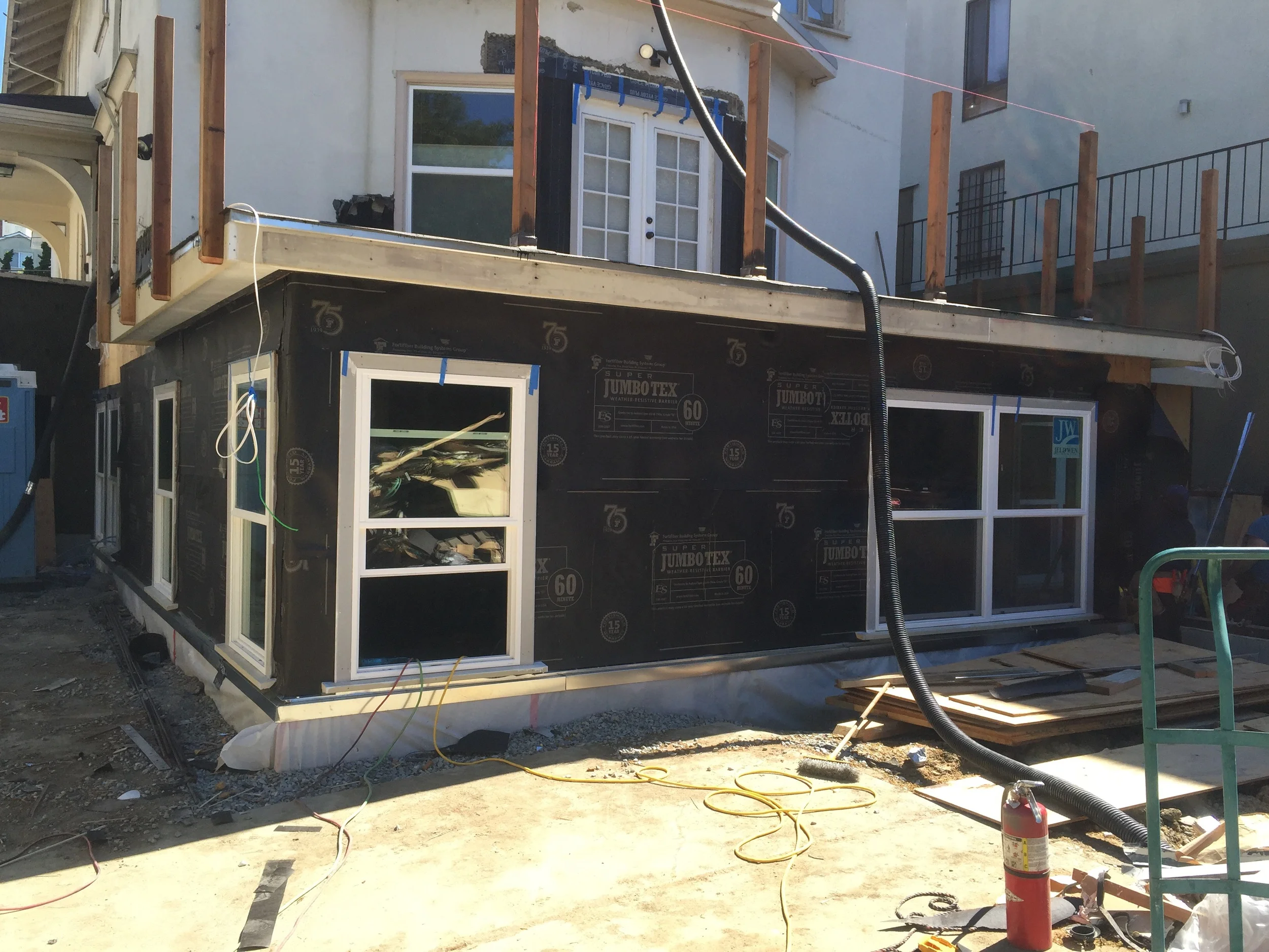 The work in progress. The walls and roof are framed, ready for stucco.