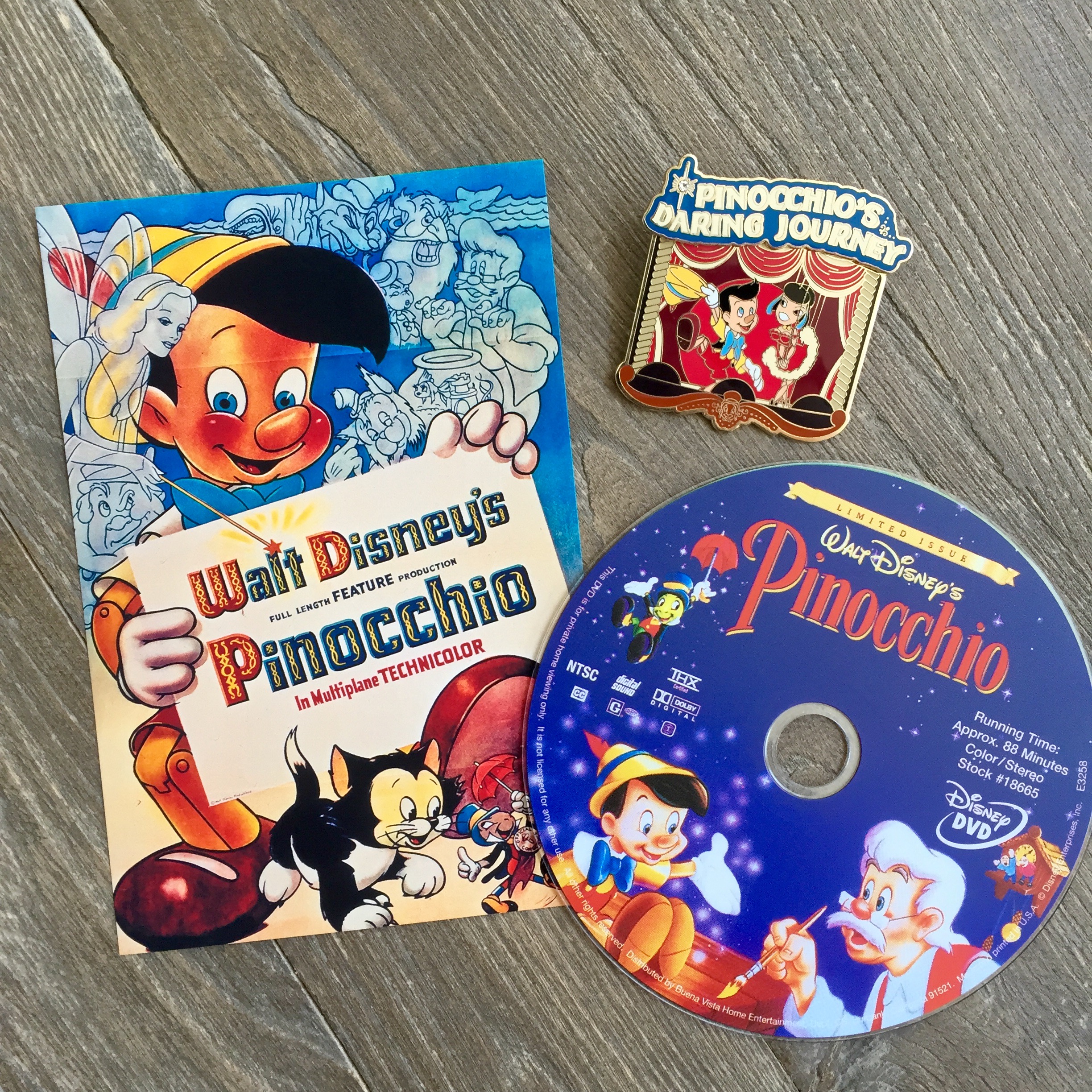 Card image from Disney.com. The pin is one we got from a cast member trade in Walt Disney Word back in 2008.