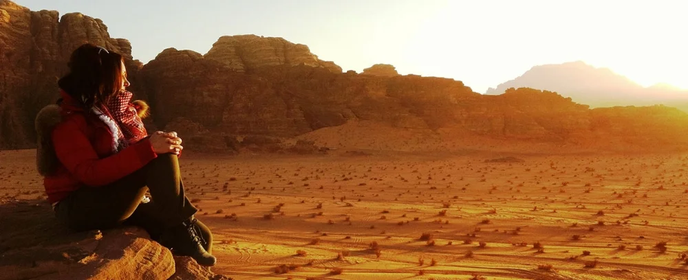 Asia-Jordan-Wadi-Rum-Woman-Watching-Sunset.jpg