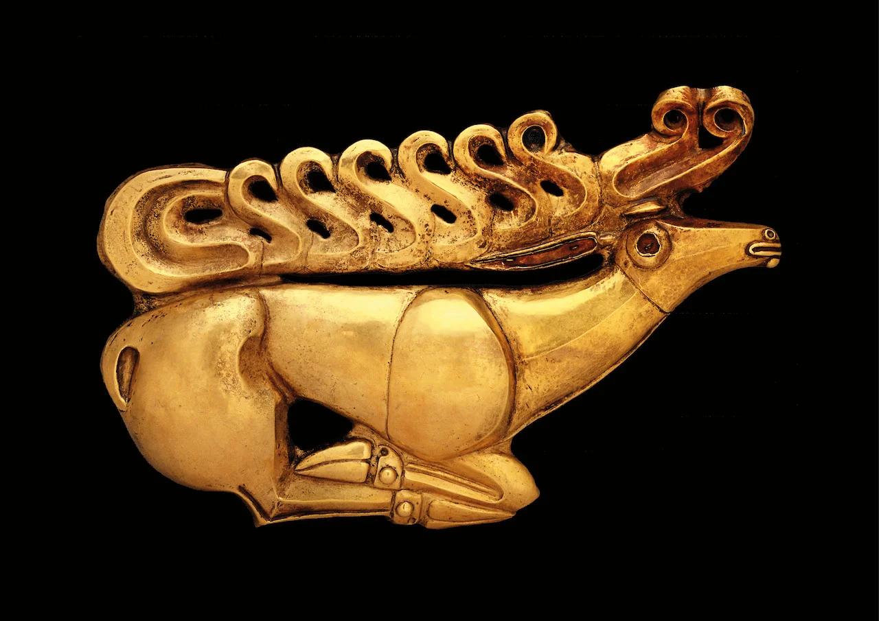 Scythian bling. Check out the rack on that. Skilled craftsmen, dead rich and obsessed with the natural world. Designs like this are stitched onto clothing and tattooed on their bodies. 