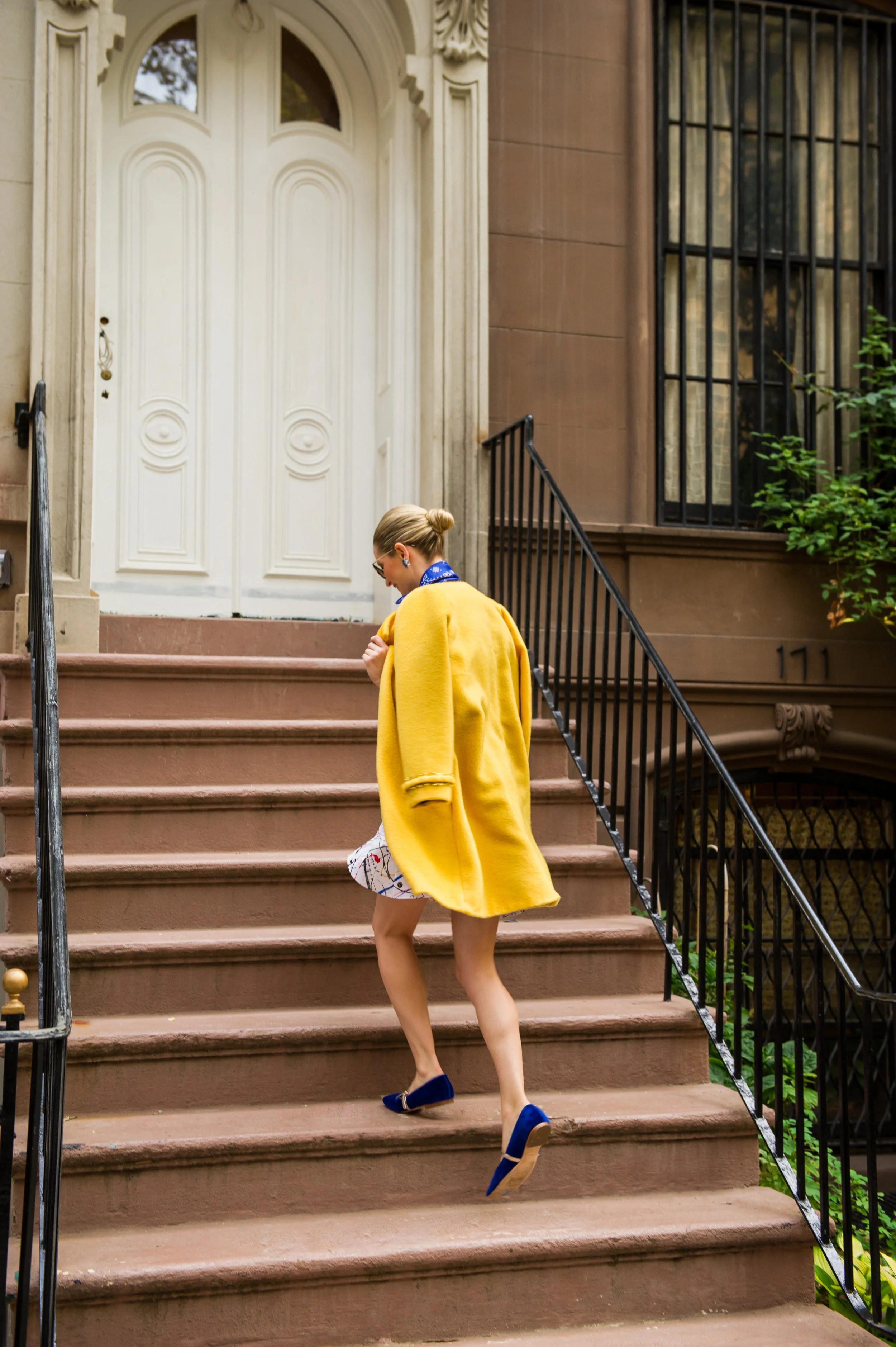 Leaping up the infamous brownstone’s staircase