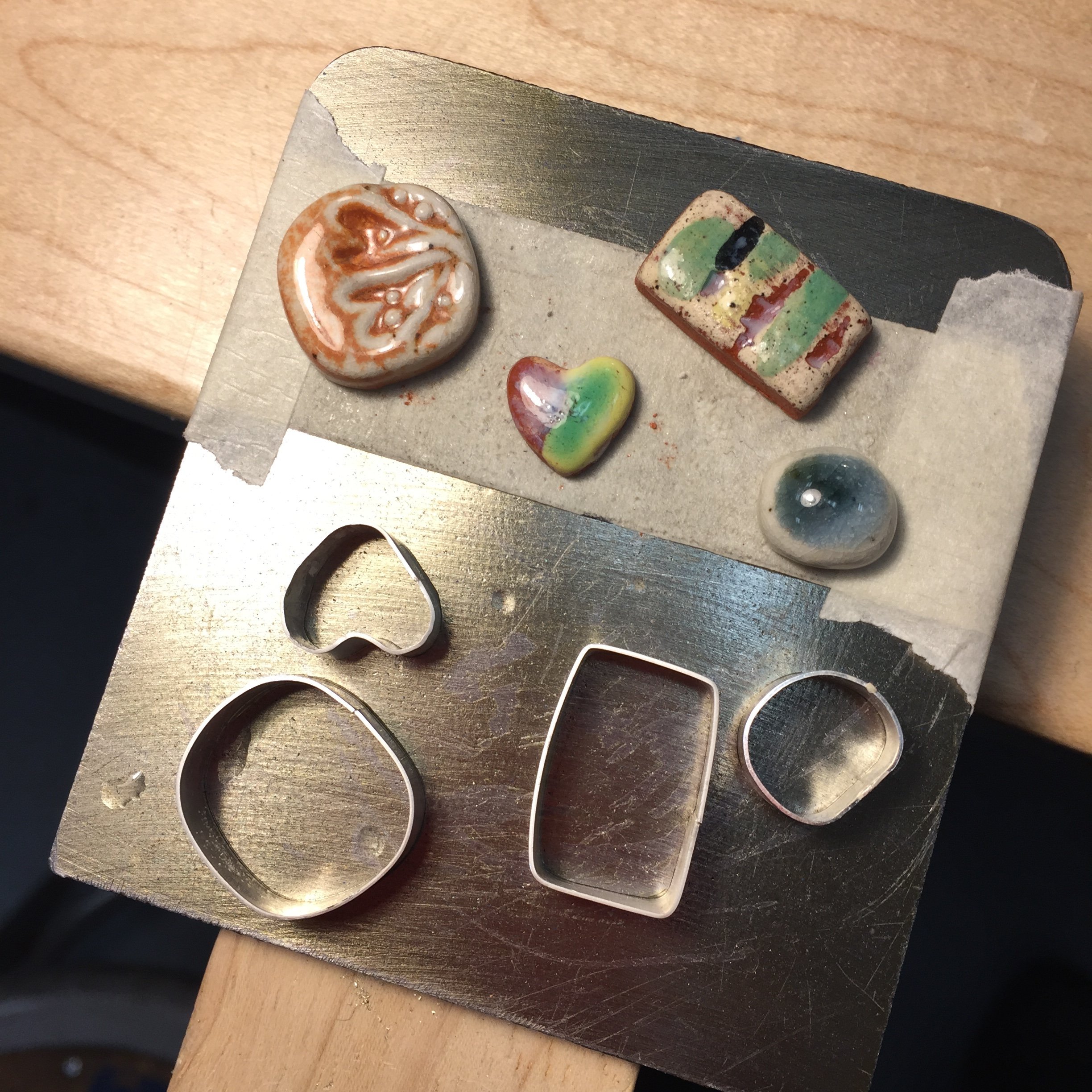 Bezels and cabochons · sterling silver, stoneware
