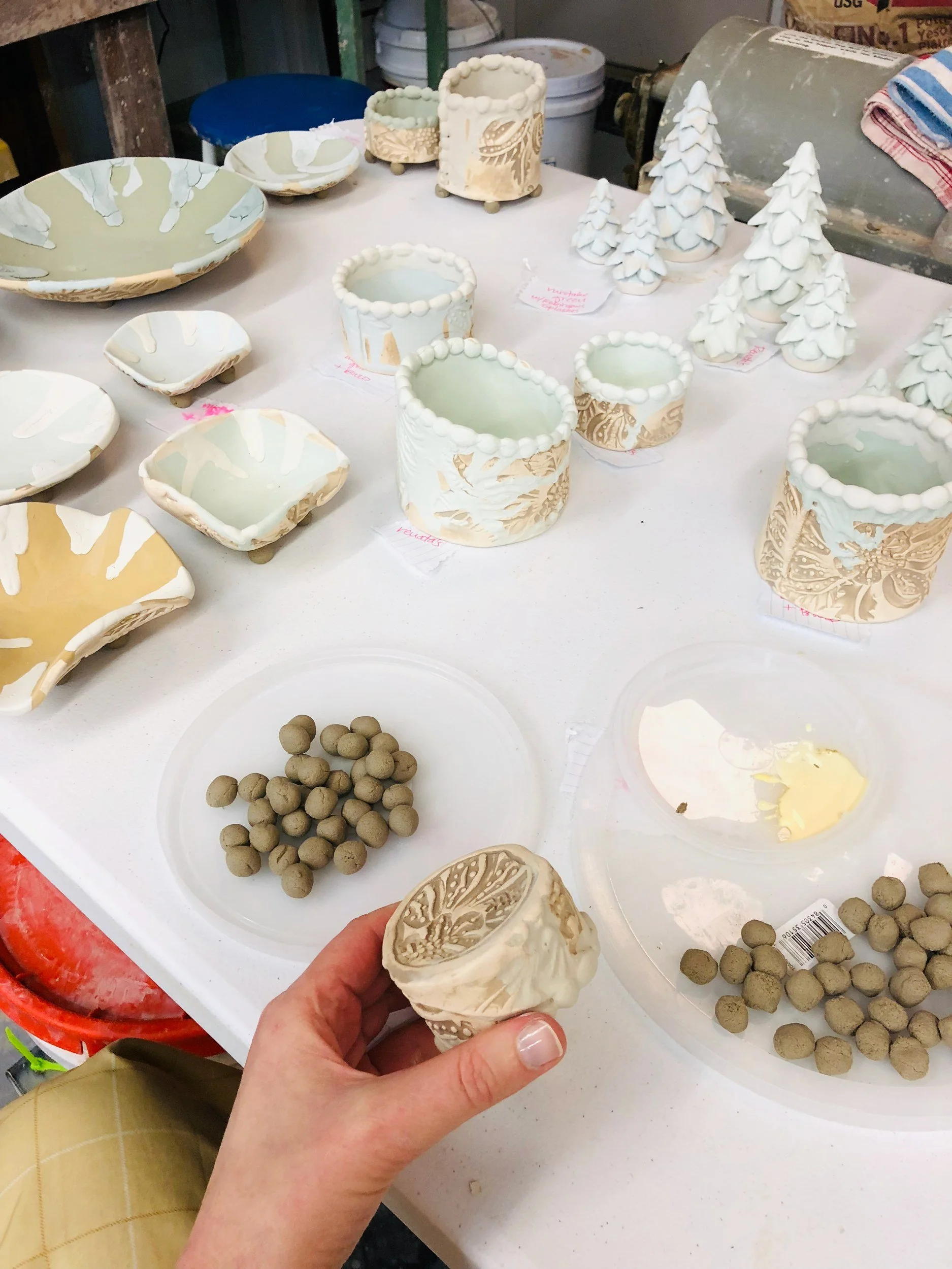 Setting a cup on wadding for the salt kiln