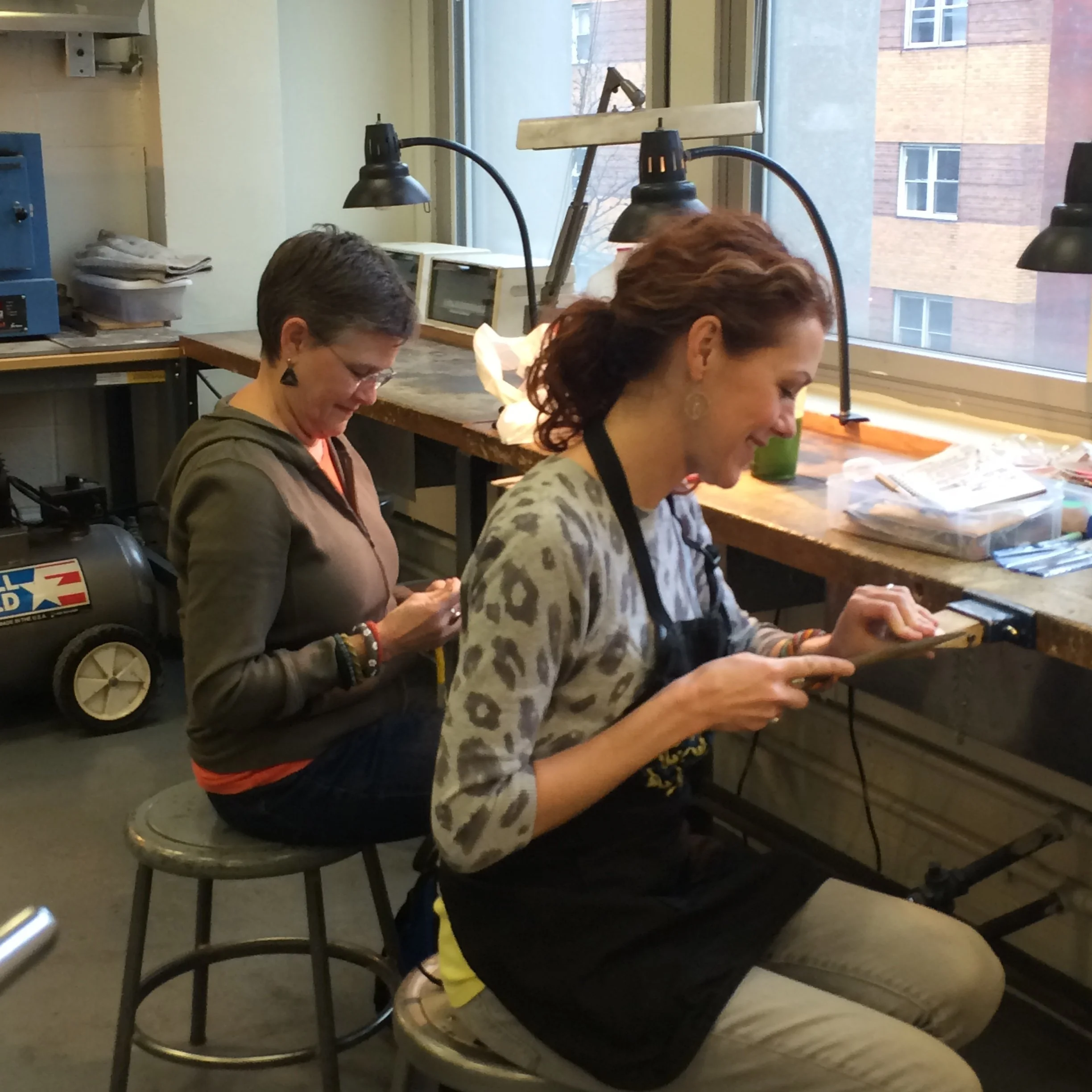 Angela and her mom, jewelry artist Terry Martin, at the jewelry bench