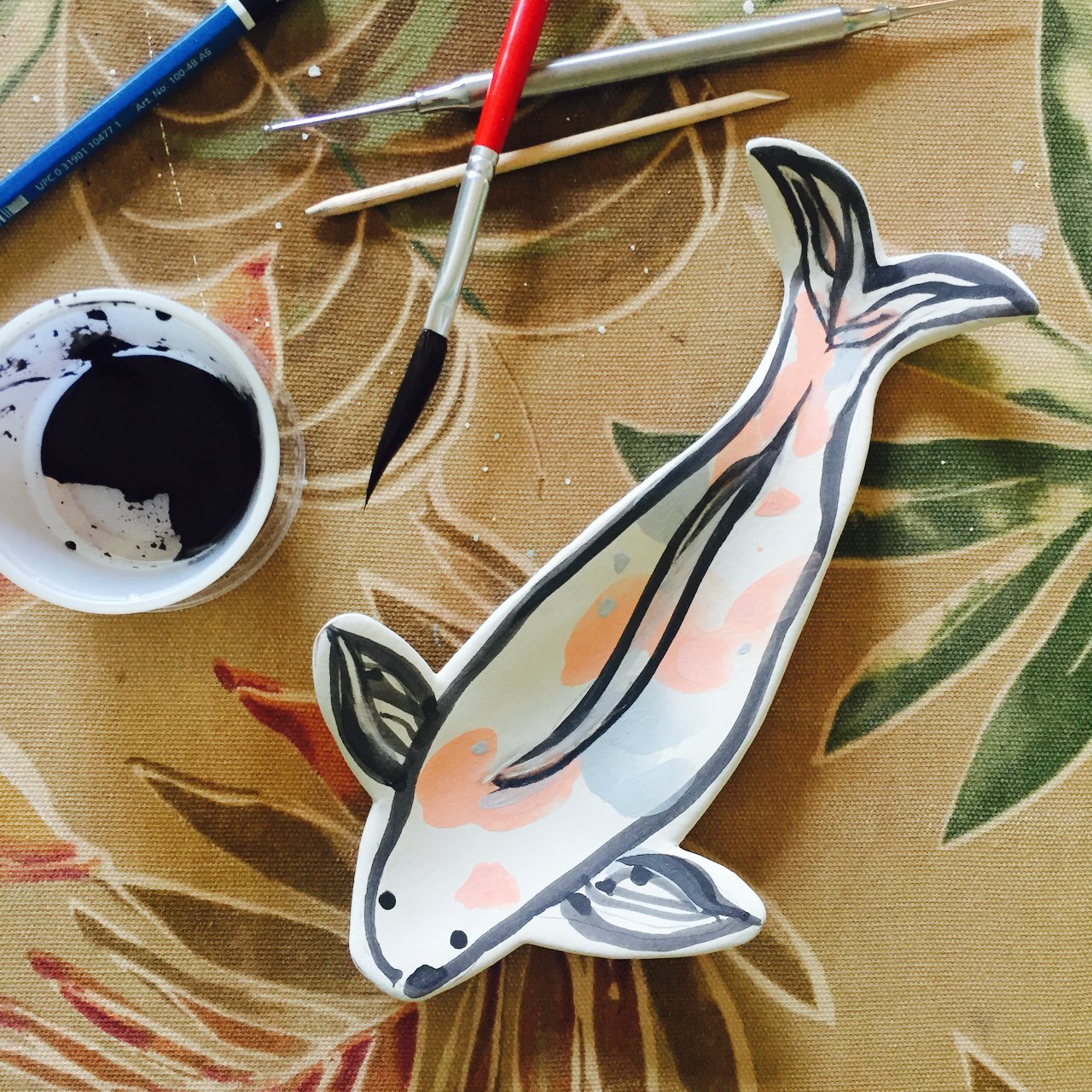 Painting a majolica koi