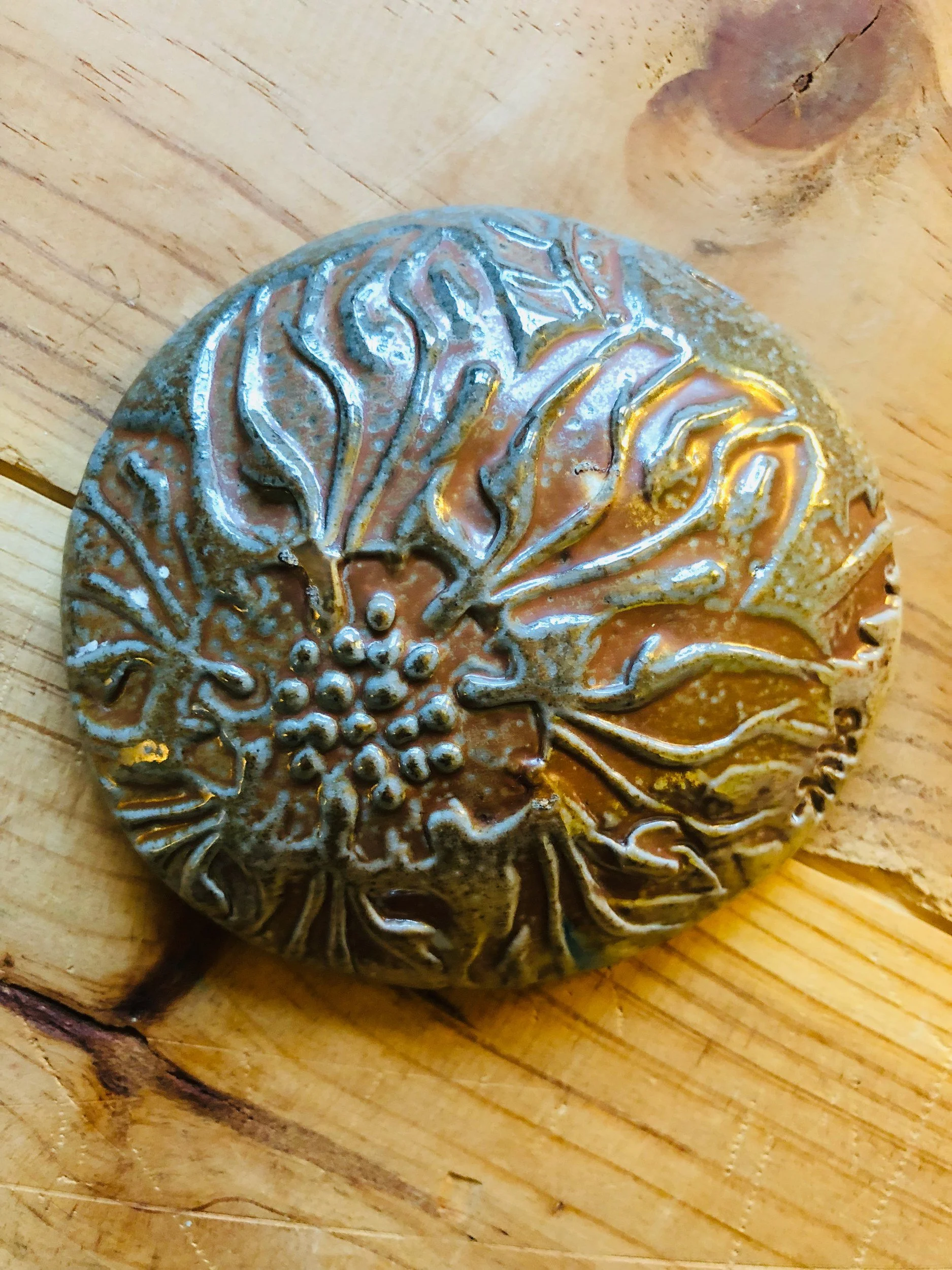 Floral textured round, lustrous glaze · salt-fired stoneware