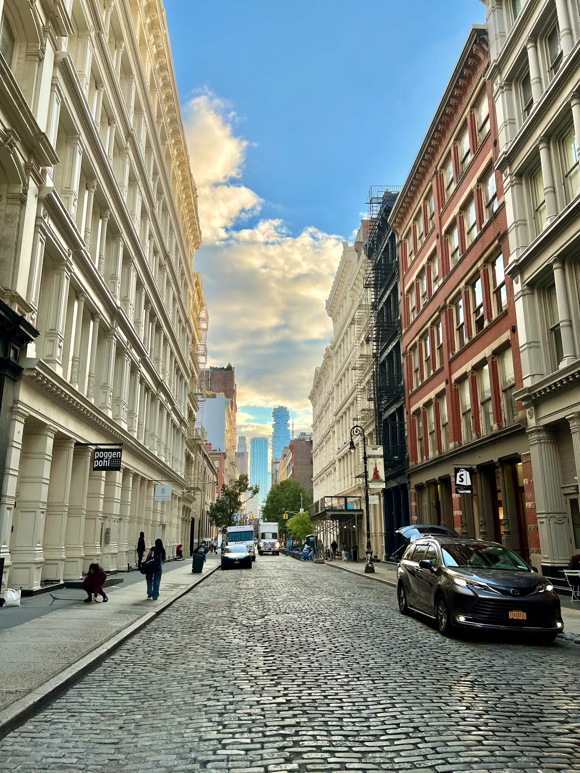 Cobblestone street lined with cast-iron buildings in SoHo, New York City