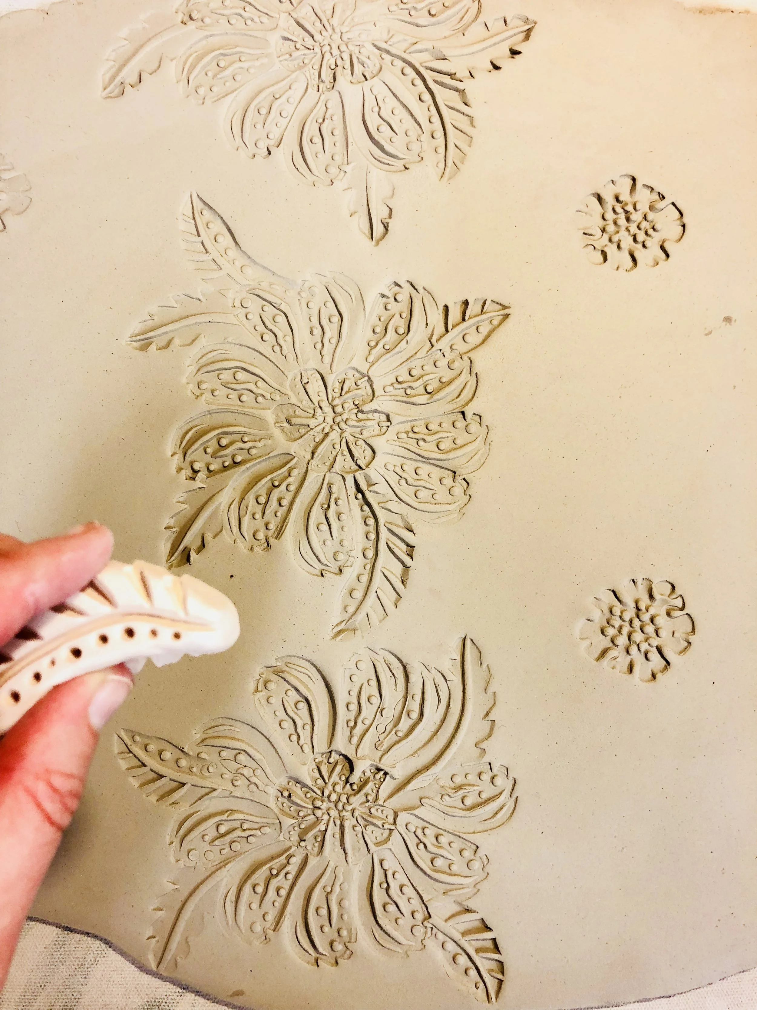 Stamping a clay slab