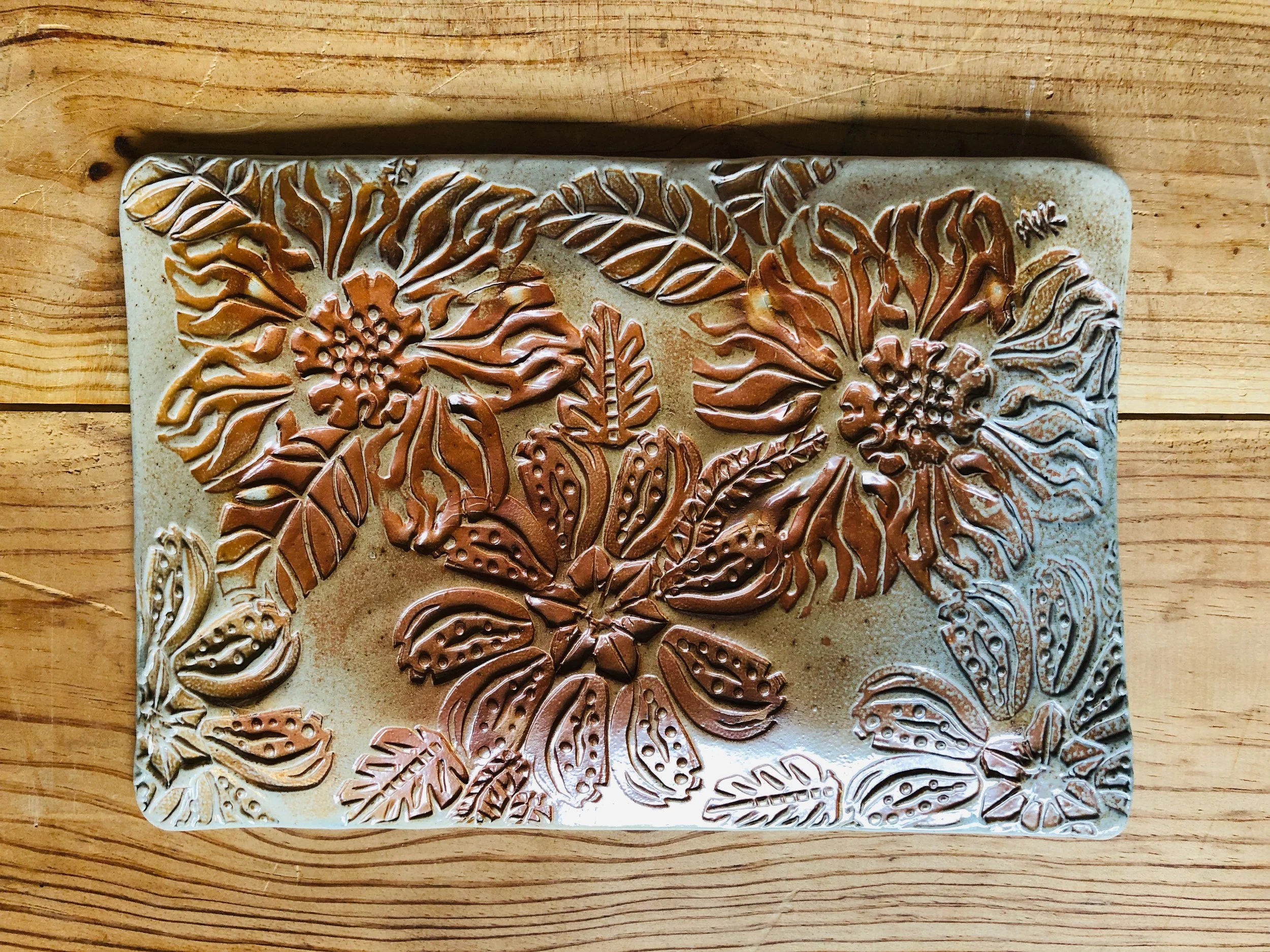 Amber floral textured tray · salt-fired stoneware