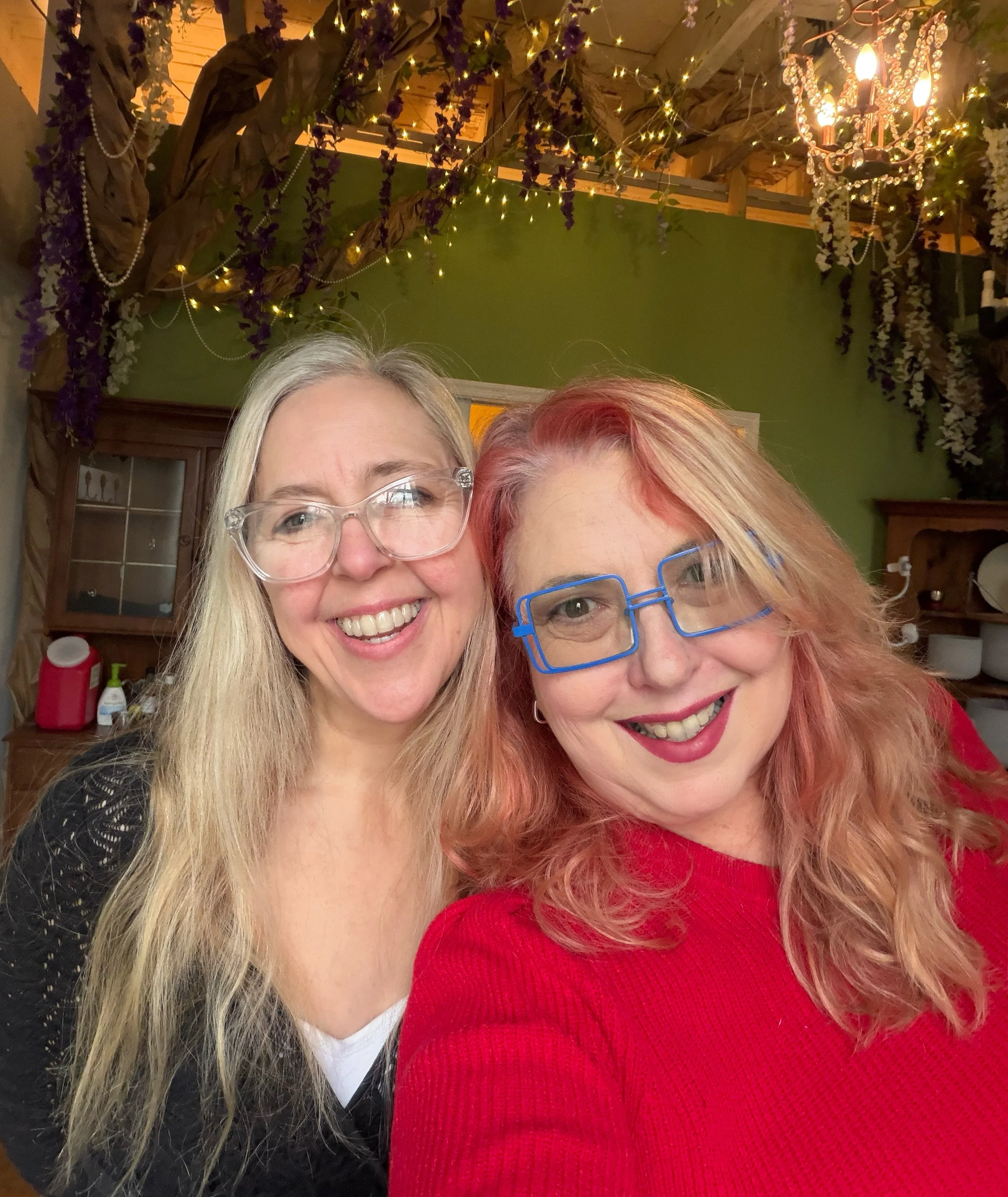 Two women standing side by side