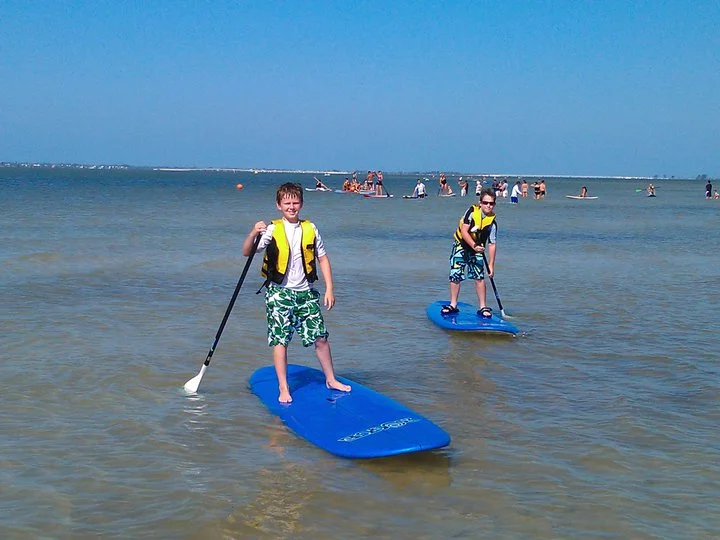Ben and Trent on paddle boards (1).jpg